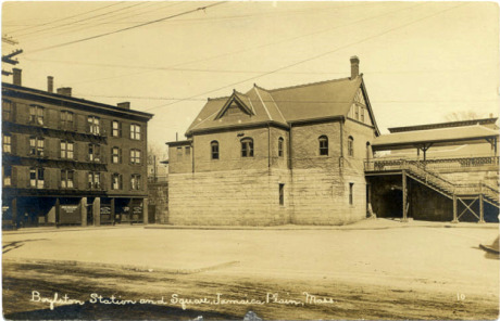   A view of Boylston Station on Boylston St. between Lamartine and Amory Streets. The building to the left housed one of the early branches of the Boston Public Library along with shops and railroad offices.  