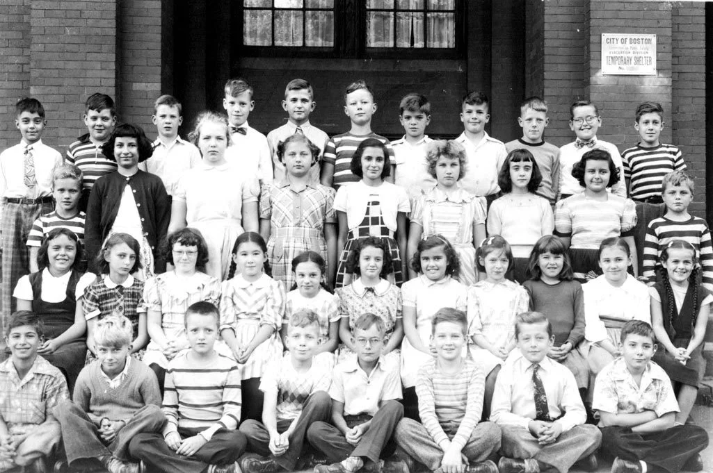Fifth grade class of Miss Mary C. Moretti taken in 1949. Jamaica Plain Historical Society founder Walter Marx stands fourth from the left in the top row. Paul Rudd, standing in the far left of the second row appeared in the 1978 feature film, The Betsy , and is now drama professor at The New School in New York City. Rudd also appeared on the 1970s soap operas Beacon Hill, Beulah Land, and Knots Landing. Photograph provided courtesy of Paul B. Gill, Jr. 