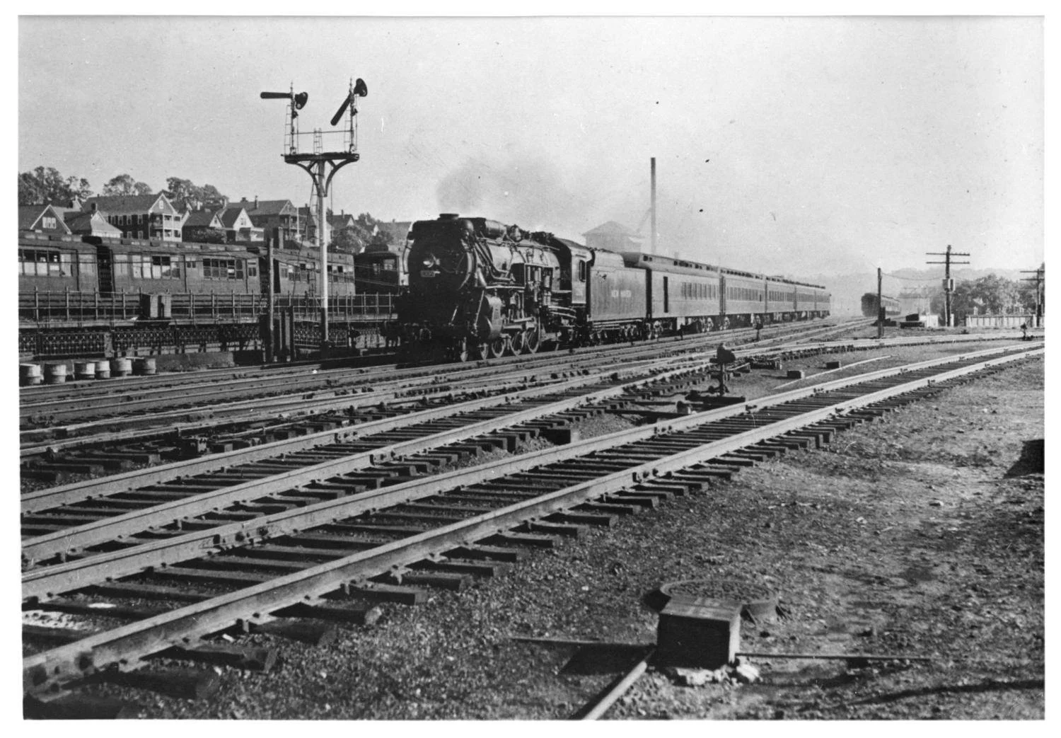 The Yankee Clipper, an upscale New Haven passenger train that ran between New York and Boston, rumbles through Forest Hills in 1934. Photograph courtesy of Paul French, Boston Transit History. Download