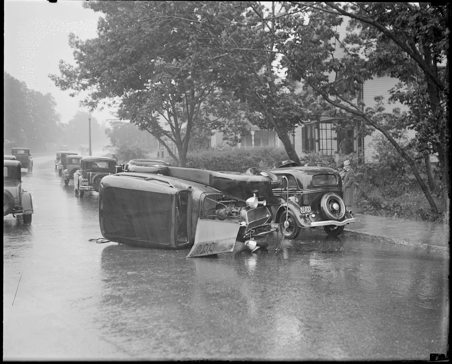 Stolen car wrecked in Jamaica Plain. Courtesy of the Boston Public Library. Copyright © Leslie Jones. filename : 08_06_000220
