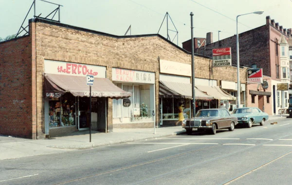 These businesses occupy the block of Centre St. between the driveway and Burroughs St. The addresses are 733, 735, 729, 725, 723, and 713 Centre St. As of March 2003, the businesses occupying this block, from left to right, are Hyde Park Cooperative Bank, Boing Toys, Peoples Federal Savings Bank, Costello's, and Coldwell Banker.