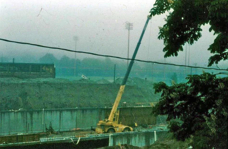 Construction of the Southwest Corridor rail lines and park in Jamaica Plain in the early 1980s. View from Everett St. looking towards the old Sturtevant factory on Amory St. Photograph courtesy of Will and Sharlene Cochrane. Higher resolution copies of images in this gallery can be found at: http://www.archive.org/details/1980sPhotographsGreenSt.AmorySt.EverettSt.JamaicaPlain