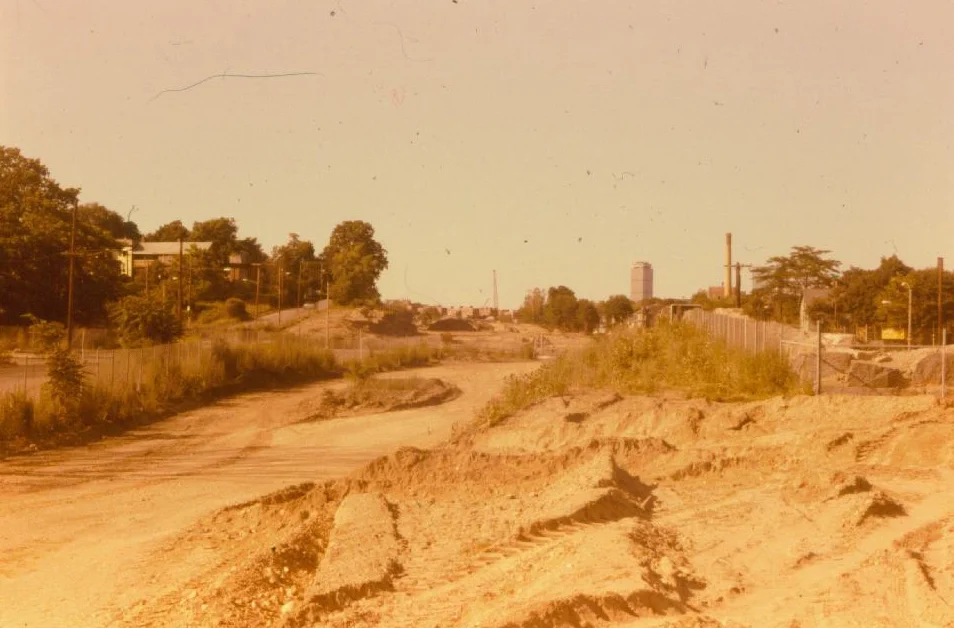 Construction of the Southwest Corridor rail lines and park in Jamaica Plain in the early 1980s. This view is looking towards the old Haffenreffer Brewery and the Prudential Center. Photograph courtesy of Will and Sharlene Cochrane. Higher resolution copies of images in this gallery can be found at: http://www.archive.org/details/1980sPhotographsGreenSt.AmorySt.EverettSt.JamaicaPlain
