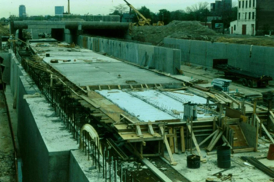 Construction of the Southwest Corridor rail lines and park in Jamaica Plain in the early 1980s. This view is looking towards the old Haffenreffer Brewery and the Prudential Center. Photograph courtesy of Will and Sharlene Cochrane. Higher resolution copies of images in this gallery can be found at: http://www.archive.org/details/1980sPhotographsGreenSt.AmorySt.EverettSt.JamaicaPlain