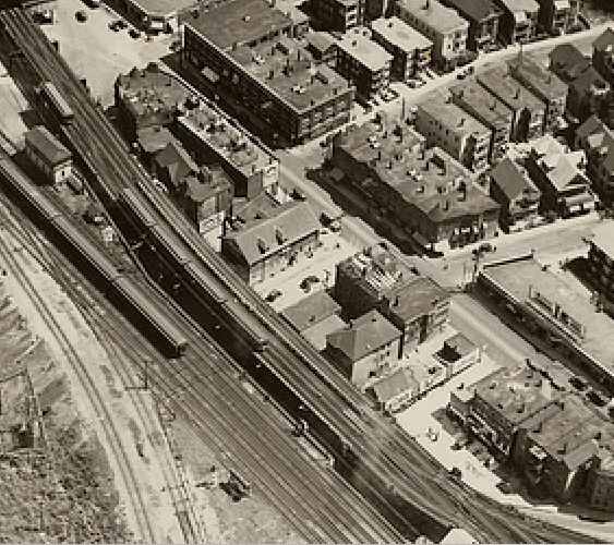 1929 aerial photo. Detail showing the Morton block oval with Tollgate Inn and Forest Hills Hotel. Boston Public Library Print Department