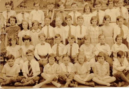 Photogaph of Dorothy Neagle Cook’s fourth grade class at the Margaret Fuller School. Dorothy is seen front row, second from the right, wearing a ribbon in her hair. A larger view of this photograph can be seen at: http://tinyurl.com/000mf