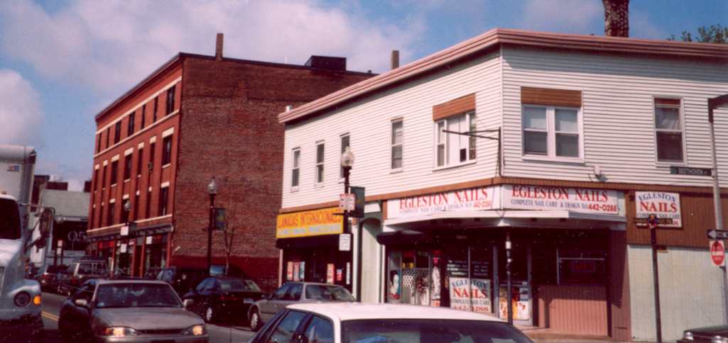 3113 and 3125 Washington Street. The Kitteredge Block was originally a double building and extended to the brick apartment house. 