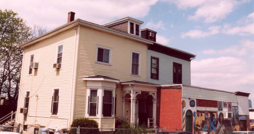 1-3 Weld Ave. The duplex house was built in 1872. It was designed and built by George Cox. The storefront was added in 1915.