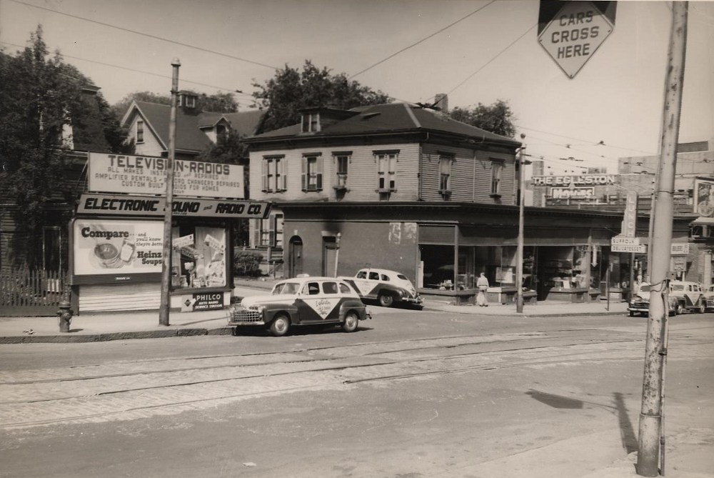 Columbus Avenue at Weld Avenue. 1948. The storefronts were built in 1917. The Radio & TV storefront was built in 1913 around a two family ca 1870 - house at 2 Weld Avenue. This burned in the early 1970’s and new stores built in 2008.City of Boston Archives.