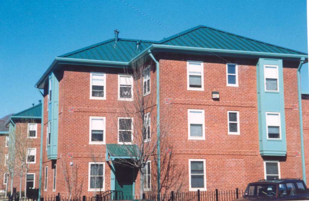 Heath Street houses at 25 Horan Way with hip roof, dormers, and entrance hood added in 1996-1997. 