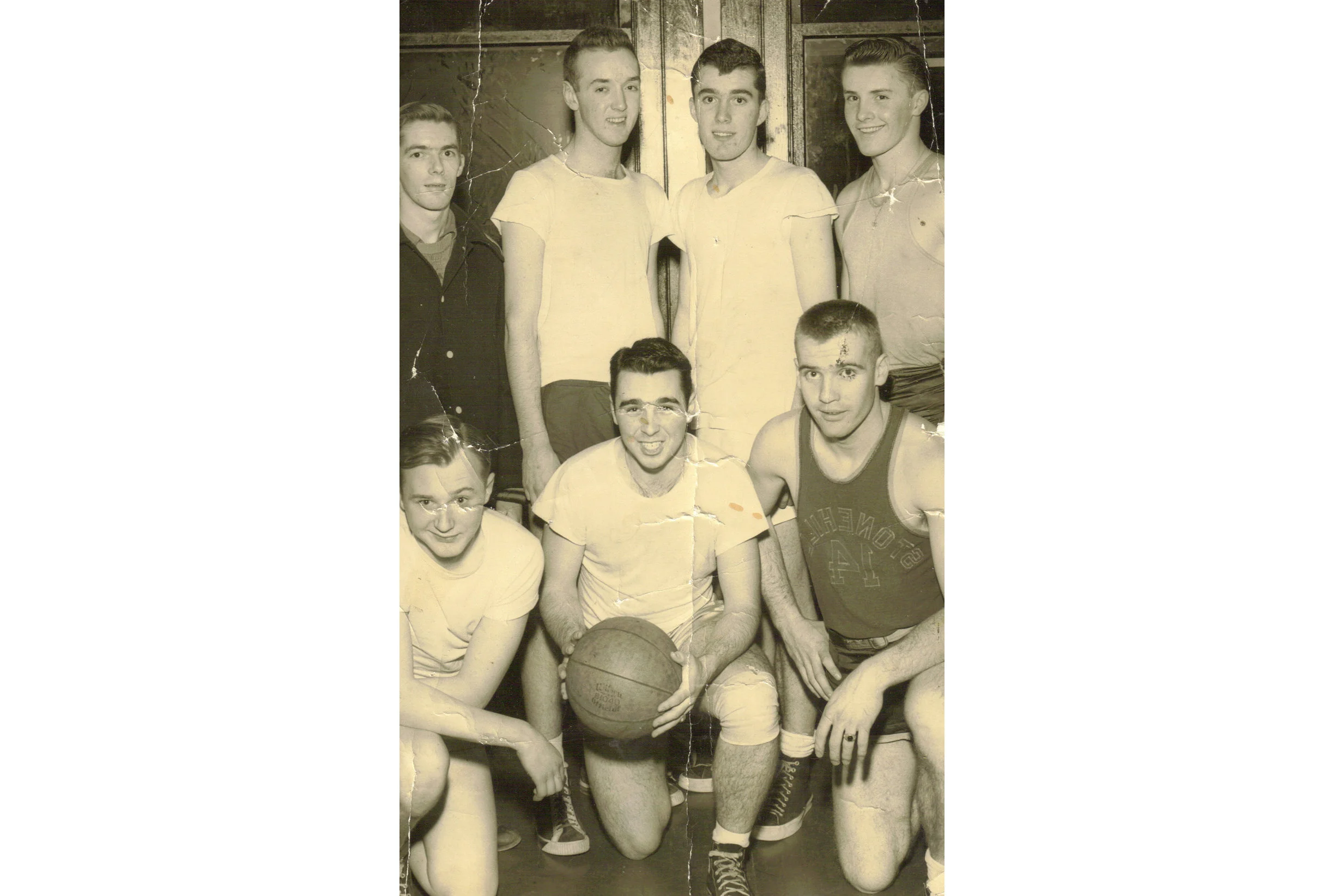 Division Basketball Champs, Park League, 1950. Front row from left to right, Bob Power, Tom Griffin, and Eddie Donovan. Rear row from left to right, Bob Quinn, Dickie Sullivan, Frannie Tighe, and Billy Donovan.