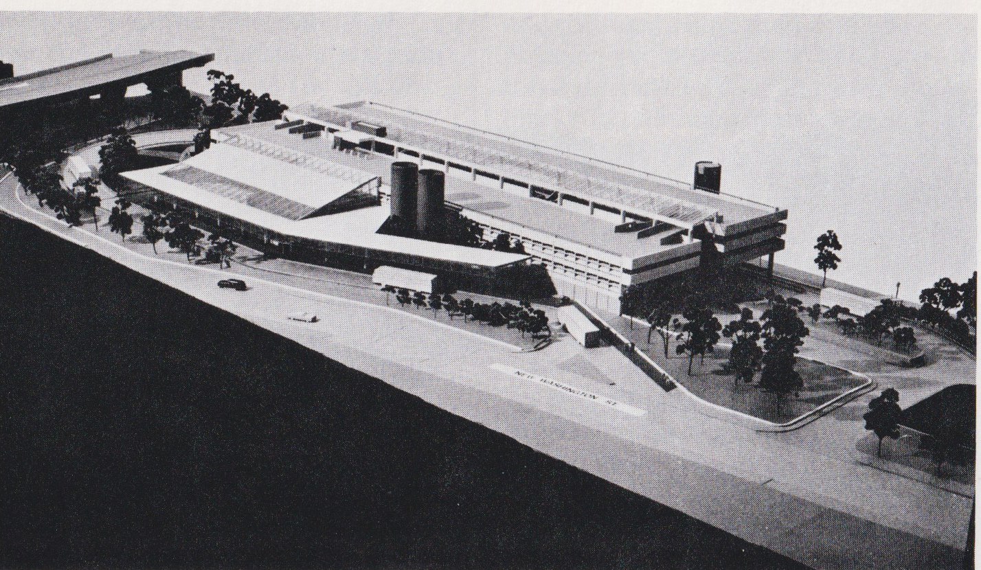 In 1978 Cambridge Seven completed this design for the new Forest Hills Station. This concept included a two-level garage over a parking lot at street level on Hyde Park Avenue. It also included two busways which circled through the station. Another significant change they proposed was to have 3 air vents built in the center of the site. The third vent was added to provide ventilation for the garage. However, local opposition to the garage, changes in elected officials and budget reductions on the Southwest Corridor project forced a complete redesign, The garage was eliminated and busway routes changed. The actual new station was complete in 1982. This rendering is from the Jamaica Plain District Profile published by the Boston Redevelopment Authority in 1979.