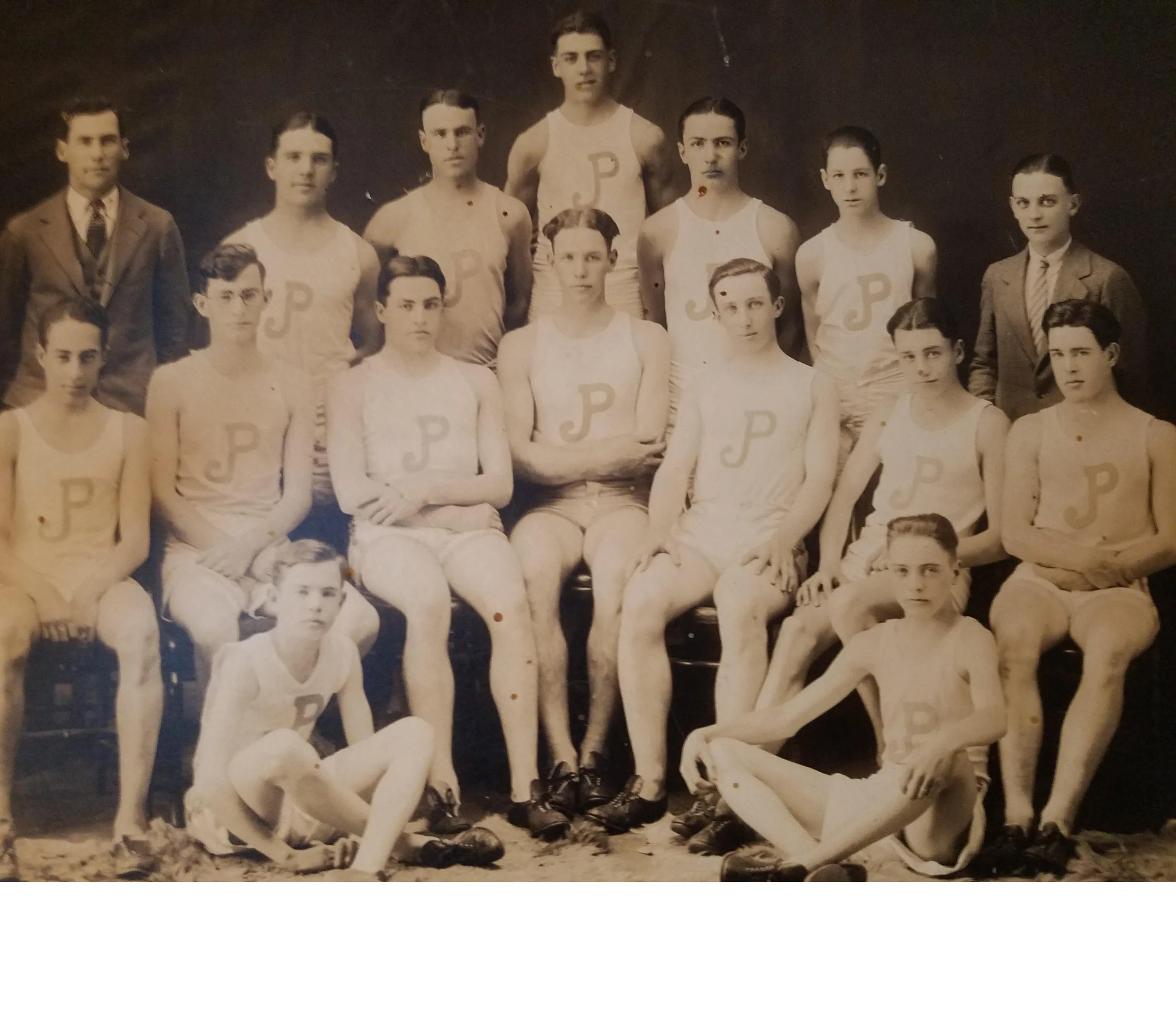 1925 Jamaica Plain High School Track Team Top row (left to right): Duffy - Coach, O'Brien - 50 yards, Thain - 50 yards, Garrity - 1000 yards, Dunkle - 300 yards, Ladeau - High Jump, Ziegerball -Manager. Middle row (left to right): Robinson - 350 yards, Shay - 1000 yards, Keenan - 600 yards, Costello - Captain/Hurdles, Regan - 50 yards, Simpson -220 yards, Galla- 220 yards. Bottom row (left to right): Blum - Broad Jump, Carmaeckle - 50 yards. Picture by Christiansen Photo. Image provided by Bob Dunkle (great grandson of the Dunkle pictured in the top row). Download high resolution file .