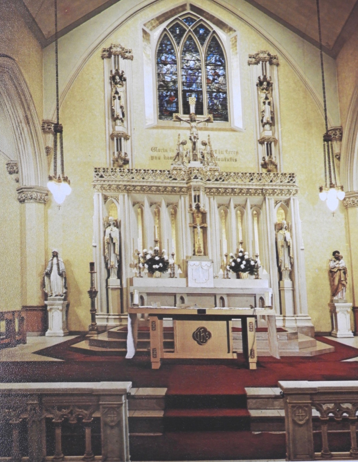 Reredos, altar, rail, and St. Thomas Aquinas window in 1969. From Centennial of St. Thomas Aquinas Church , 1969. Archives of the Archdiocese of Boston.