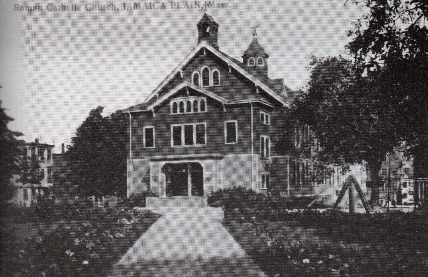 The original wooden Blessed Sacrament Church built in 1891 at the corner of Centre and Creighton Streets near Hyde Square.