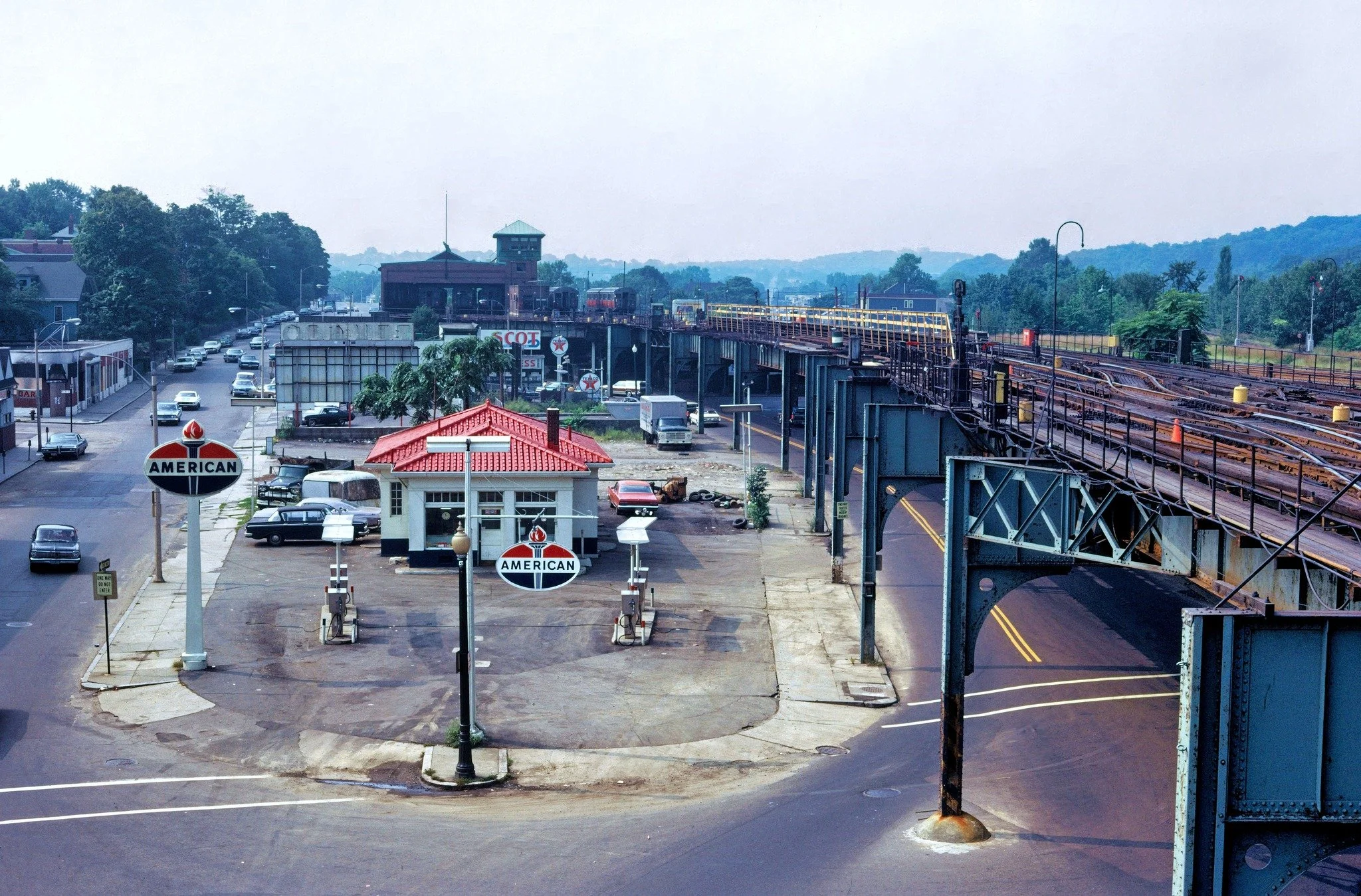  American gas station at Forest Hills circa 1963. Texaco station in the background. Photograph by Warren E. Favor, Boston Public Library. 