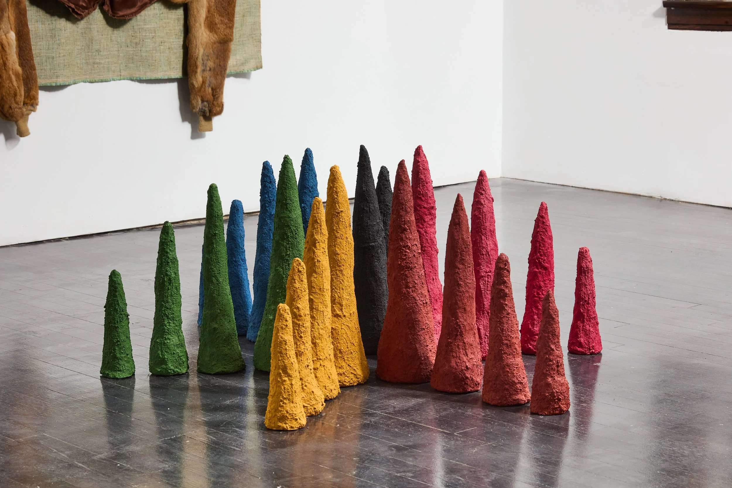   Radial Design  (2026), tabu-no-ki wood powder, guar gum and wood, natural pigments, essential oils, 52 x 52 x 20 in. (132 x 132 × 51 cm) 