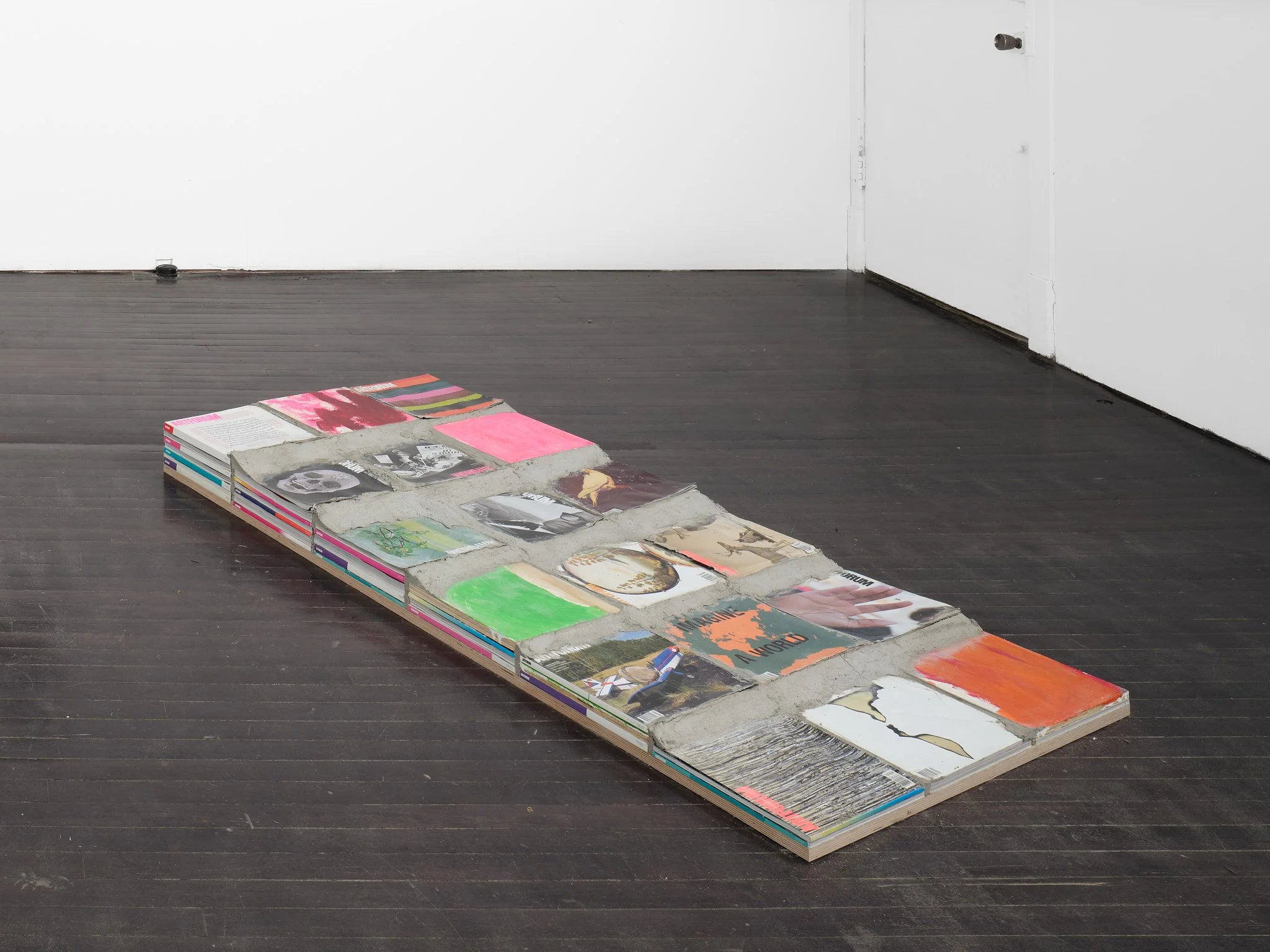   Obstacle Course  , 2026 Artforum magazines, painted plywood, and concrete, ed. 1/3 65 x 32½ x 6 in. (165 × 83 x 15 cm) 