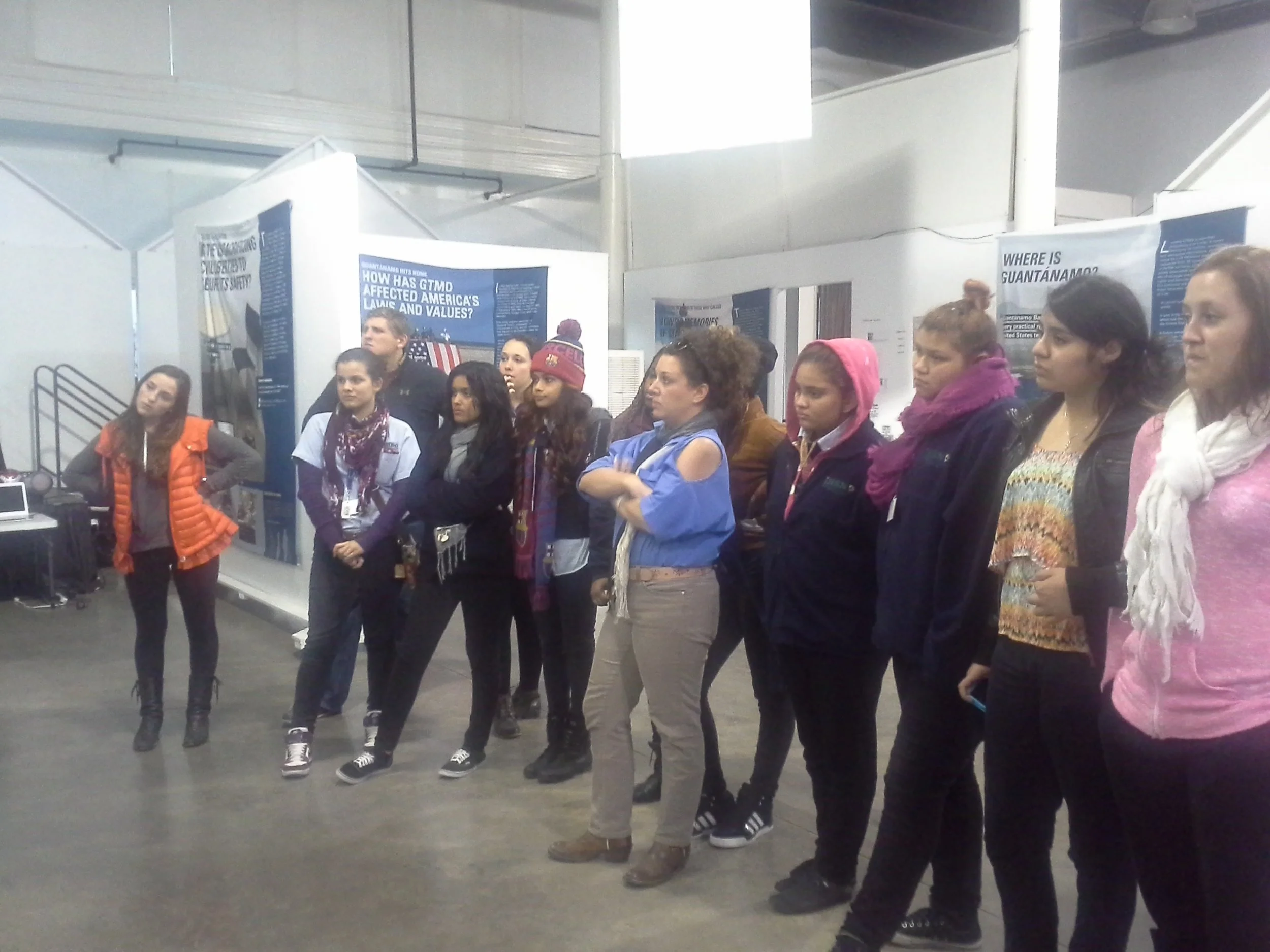 Tulane students, International High School students, and ESL instructor Heather Causey visiting the Guantanamo Public Memory Project at the Ashe Cultural Center in 2015.
