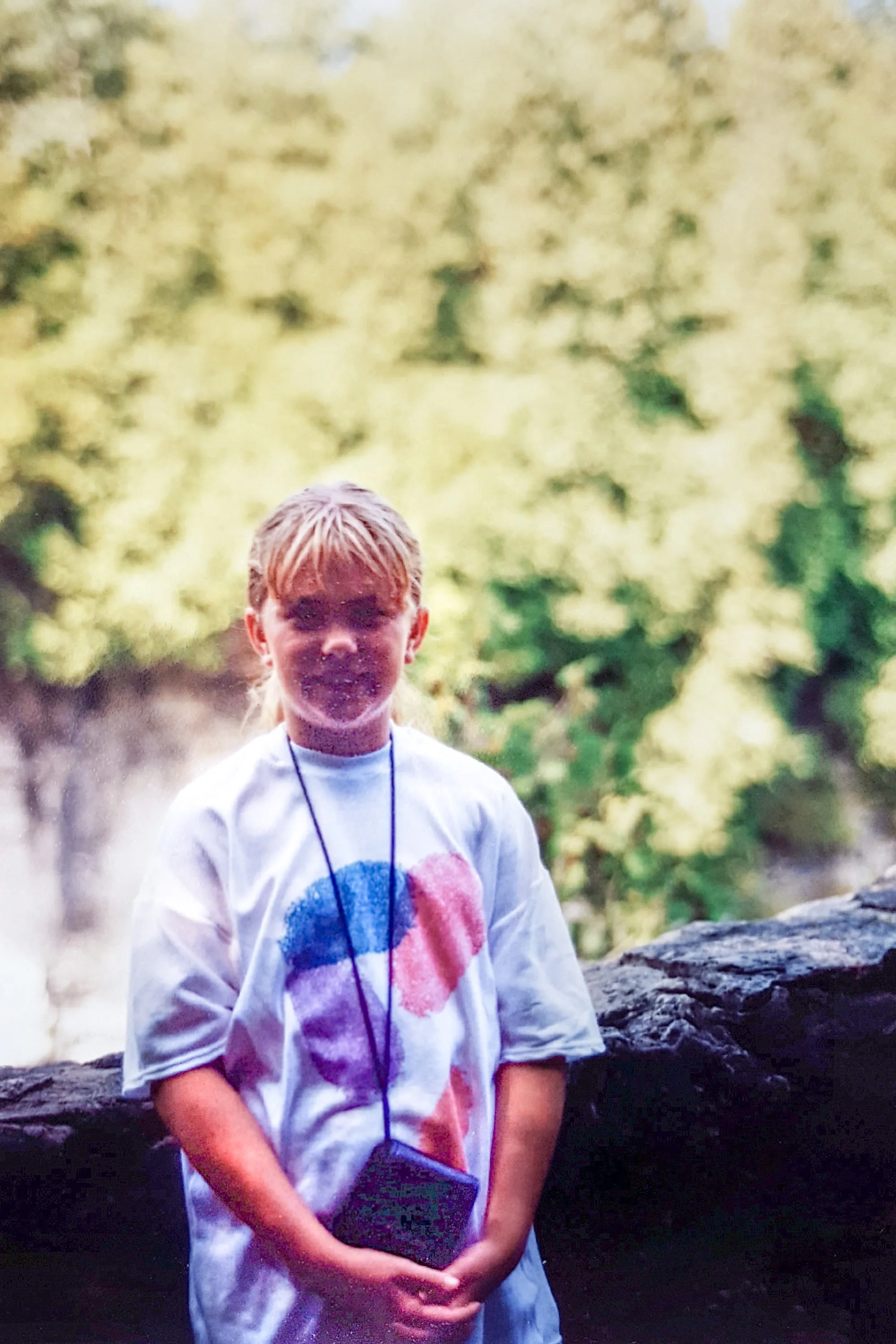Me, 9 years old, with my camera and my fingerprint t-shirt, which I truly believed was "totally rad". Photo credit: Mom.