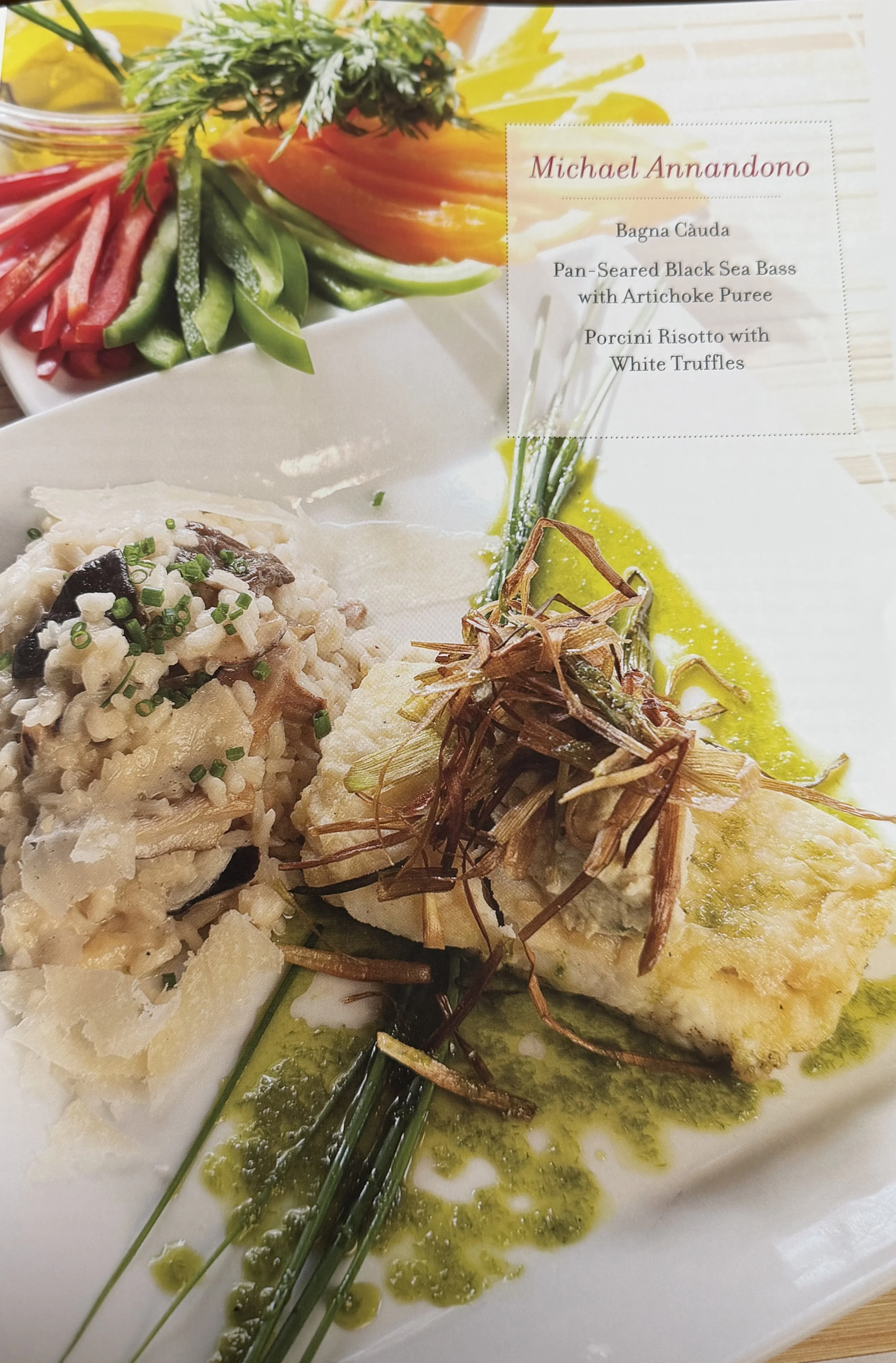 Dish featuring a yellow fish fillet topped with crispy fried shallots, served with green chive garnish and green sauce on a white plate.