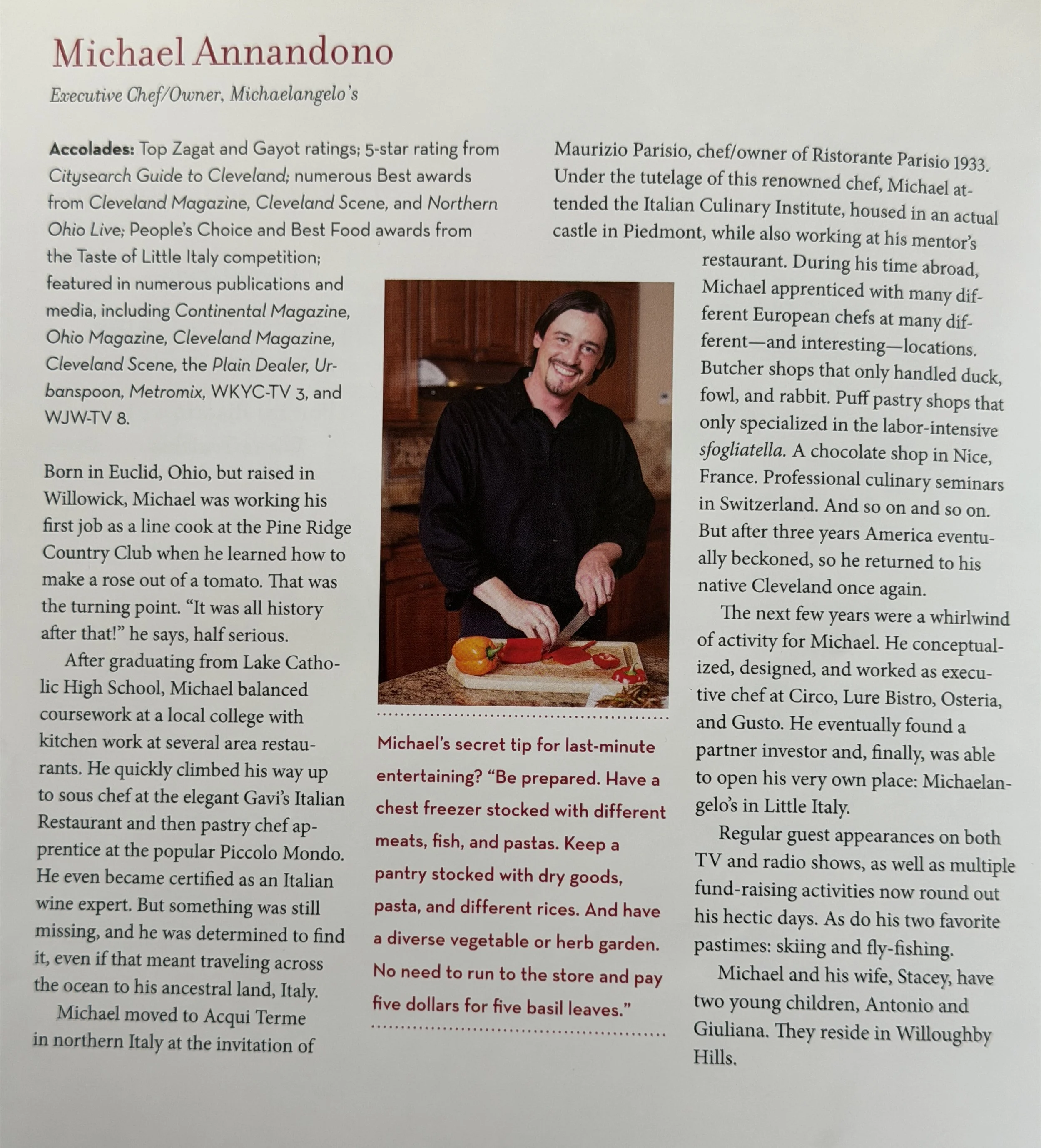 A page from a magazine or booklet featuring a profile of Michael Annandono, including a color photograph of him smiling and holding a knife and a red item in a kitchen. The text discusses his culinary background and achievements.