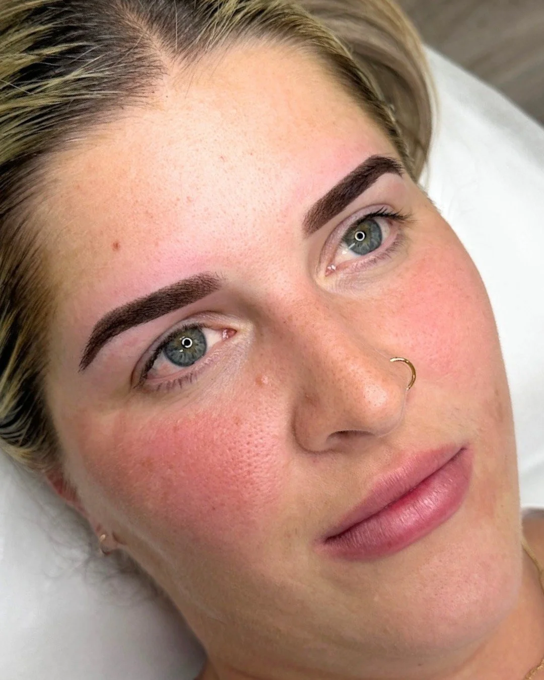 Sometimes it's not about adding more, it's about filling in what's missing.

Our client already had beautiful, full brows, but some sparser, patchy areas were bothering her. Sarah used an ombr&eacute; approach to add soft definition and create evenne