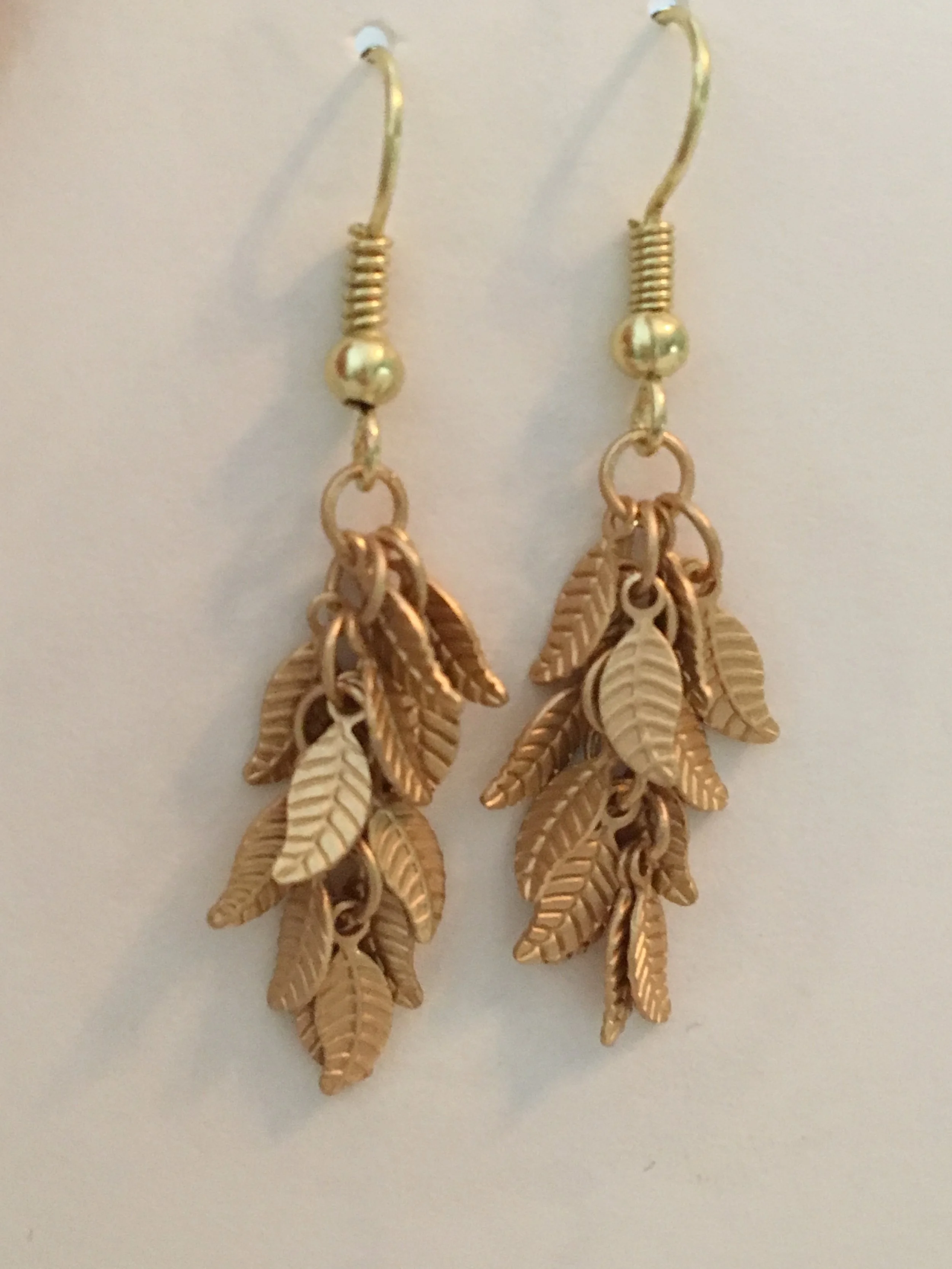 Gold leaf cluster dangle earrings