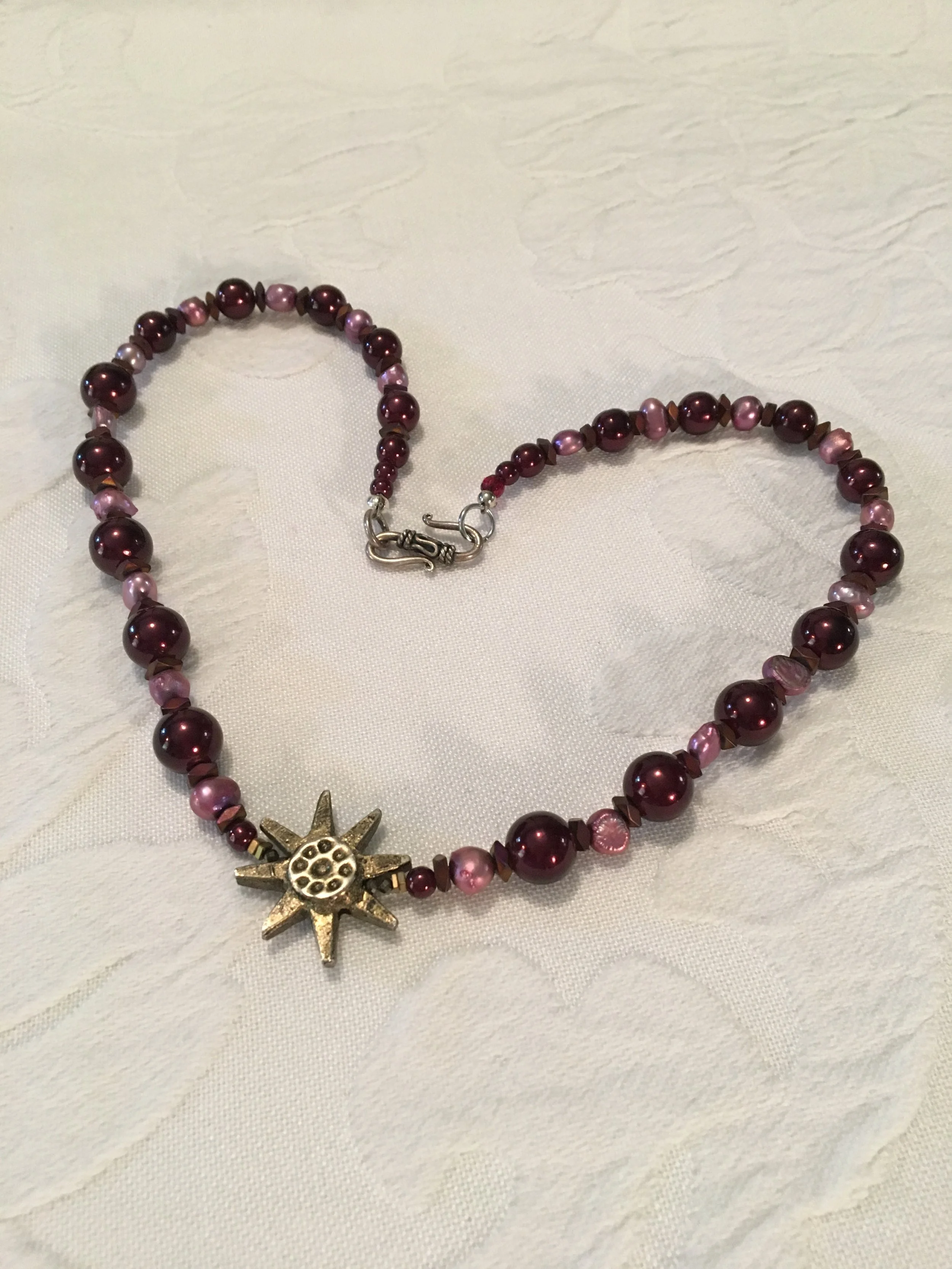 Plum glass pearls, lilac semi-baroque pearls and brass star