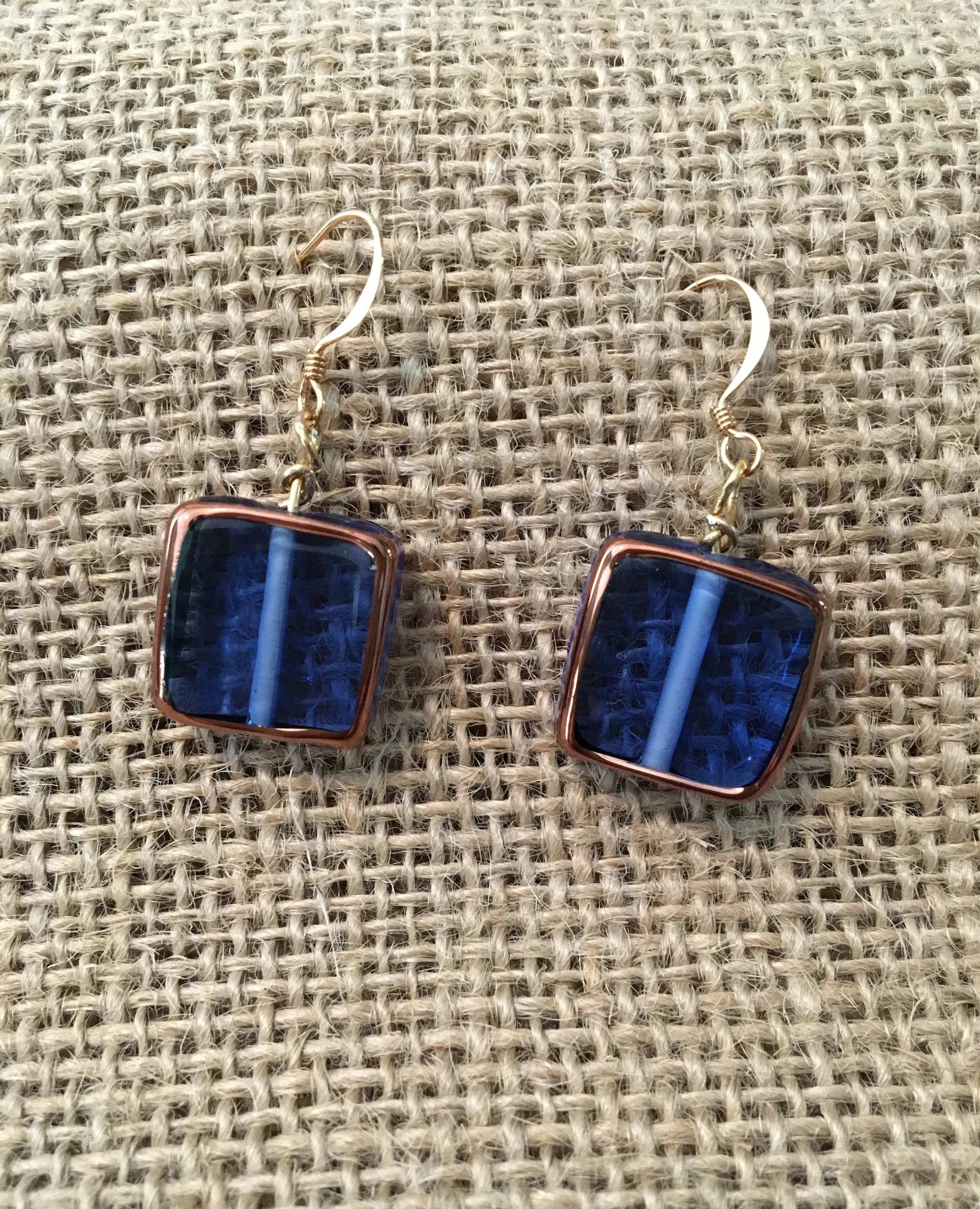 Translucent blue glass earrings with copper edging 