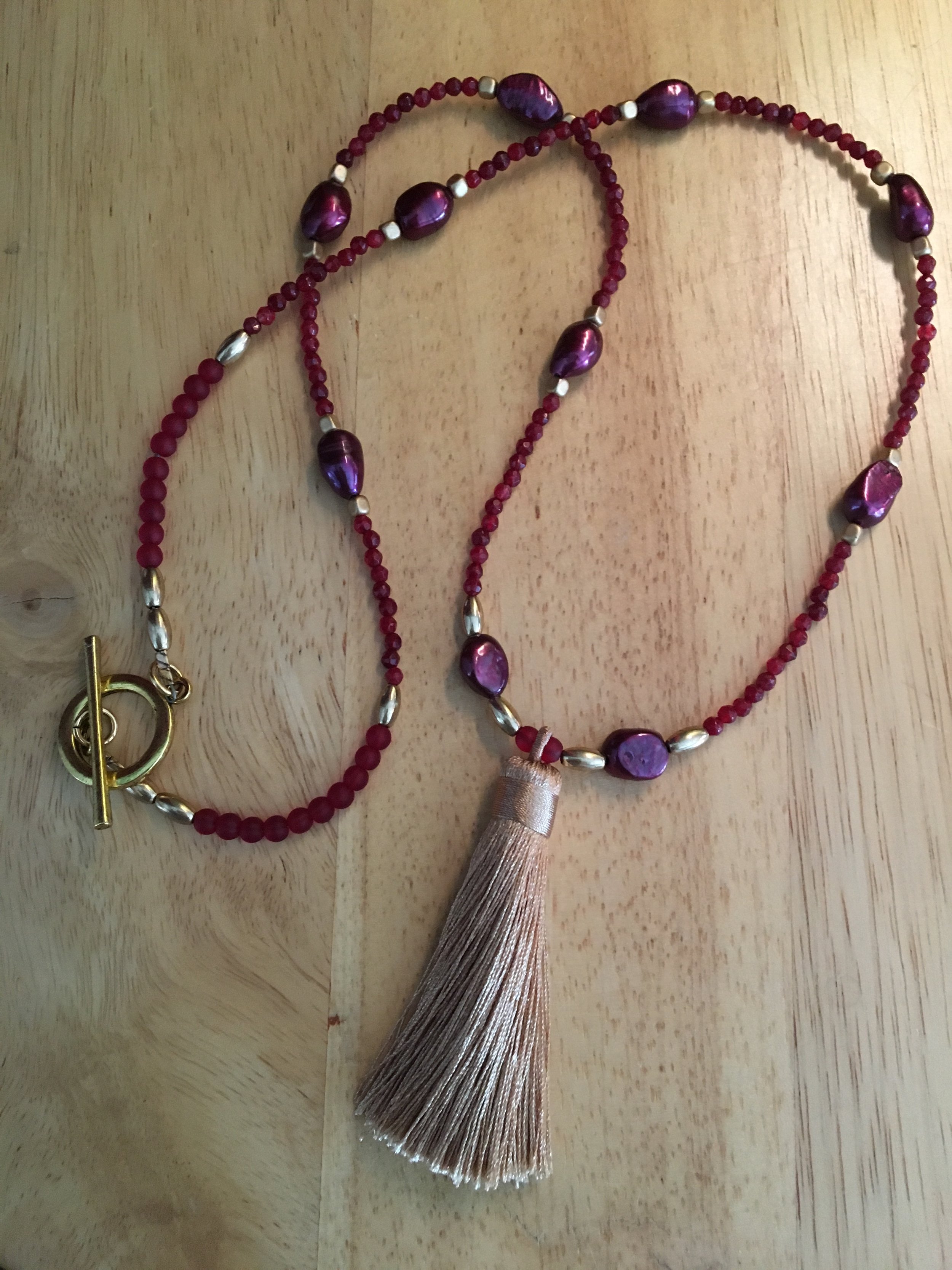 Plum pearls and ruby glass with tassel