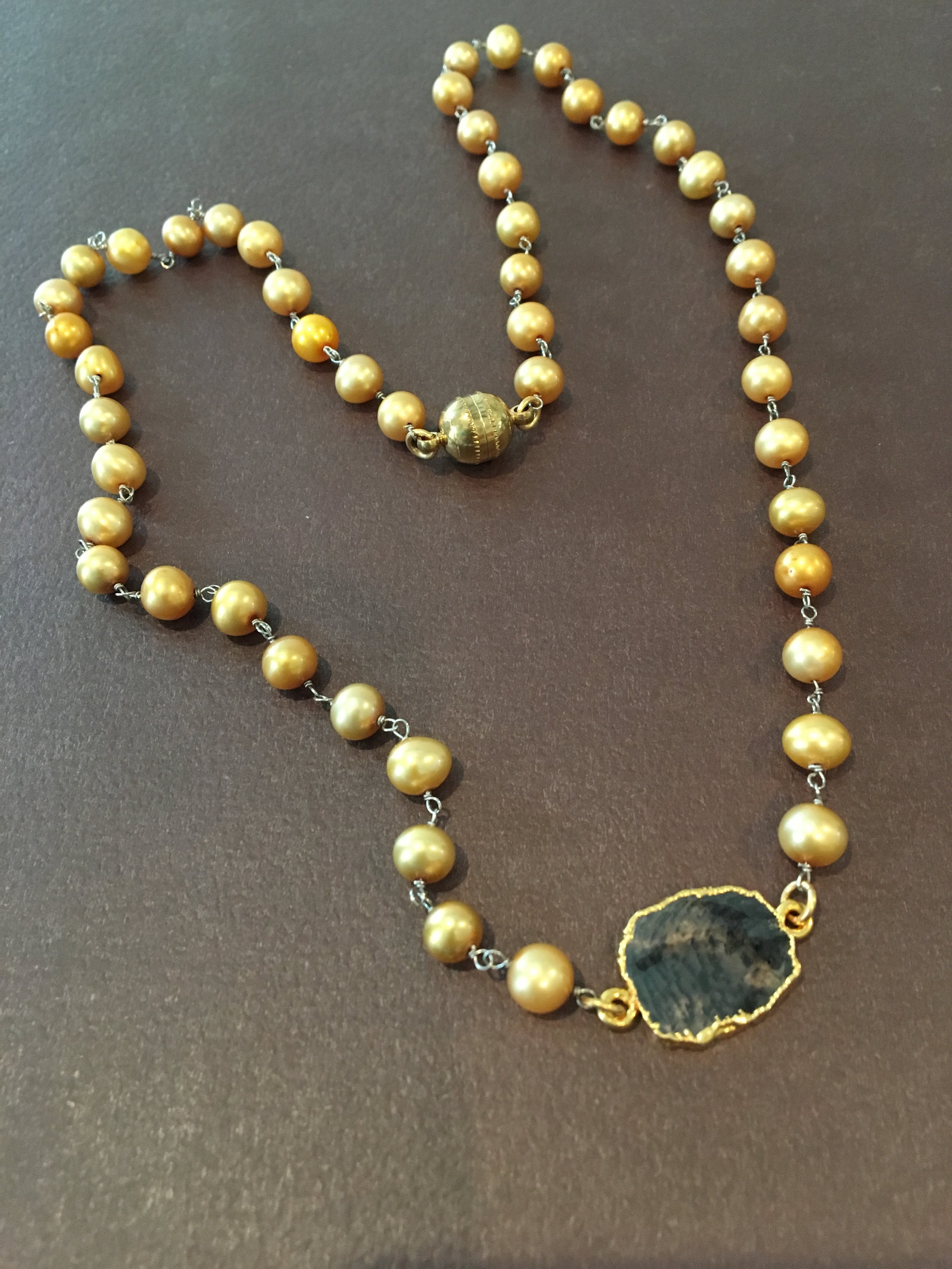 Champagne pearls and a slice