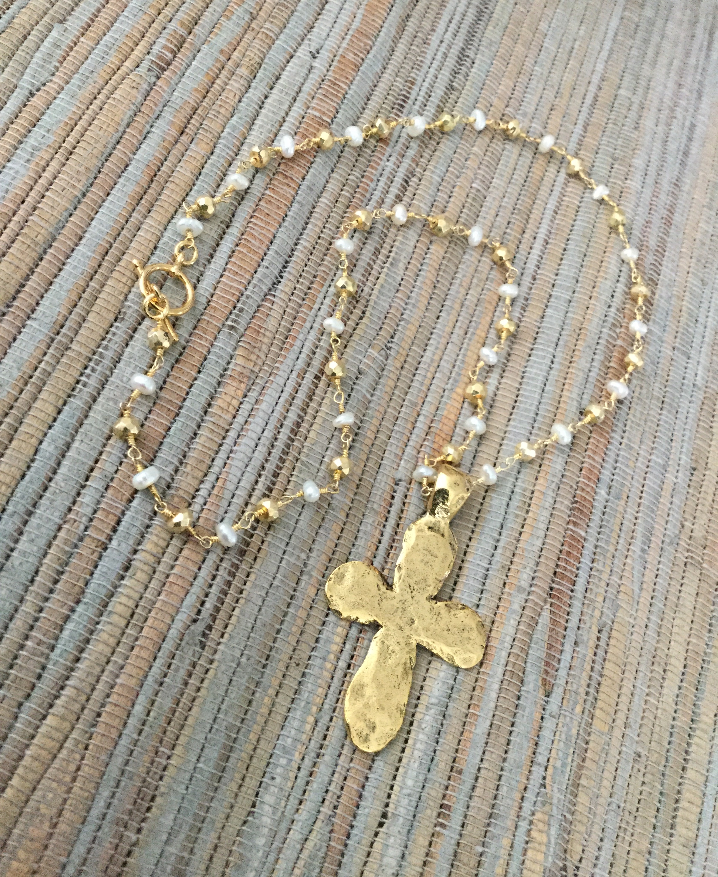 Hammered gold cross and pearls