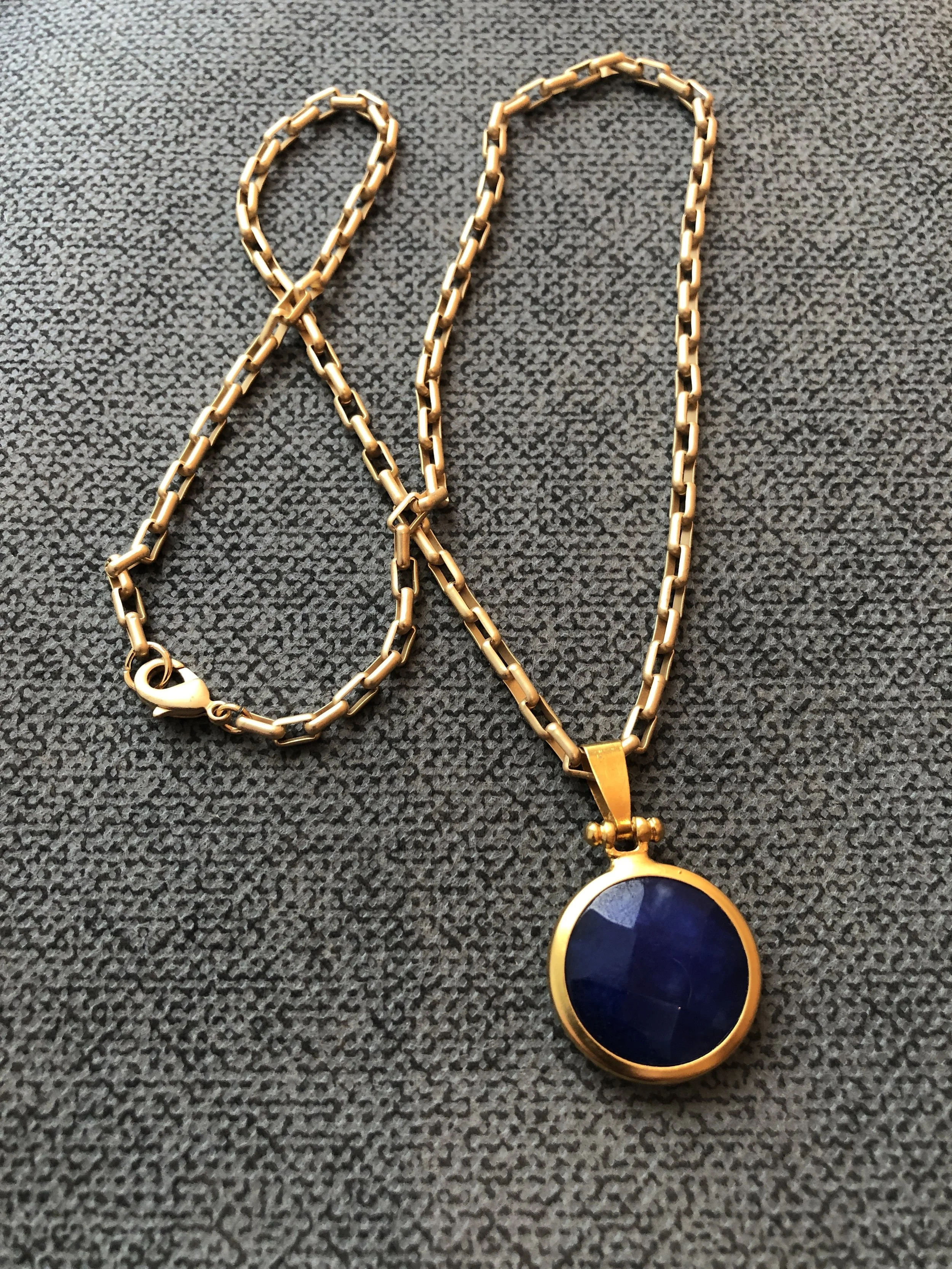 Faceted blue jade pendant set in gold, on matte gold chain