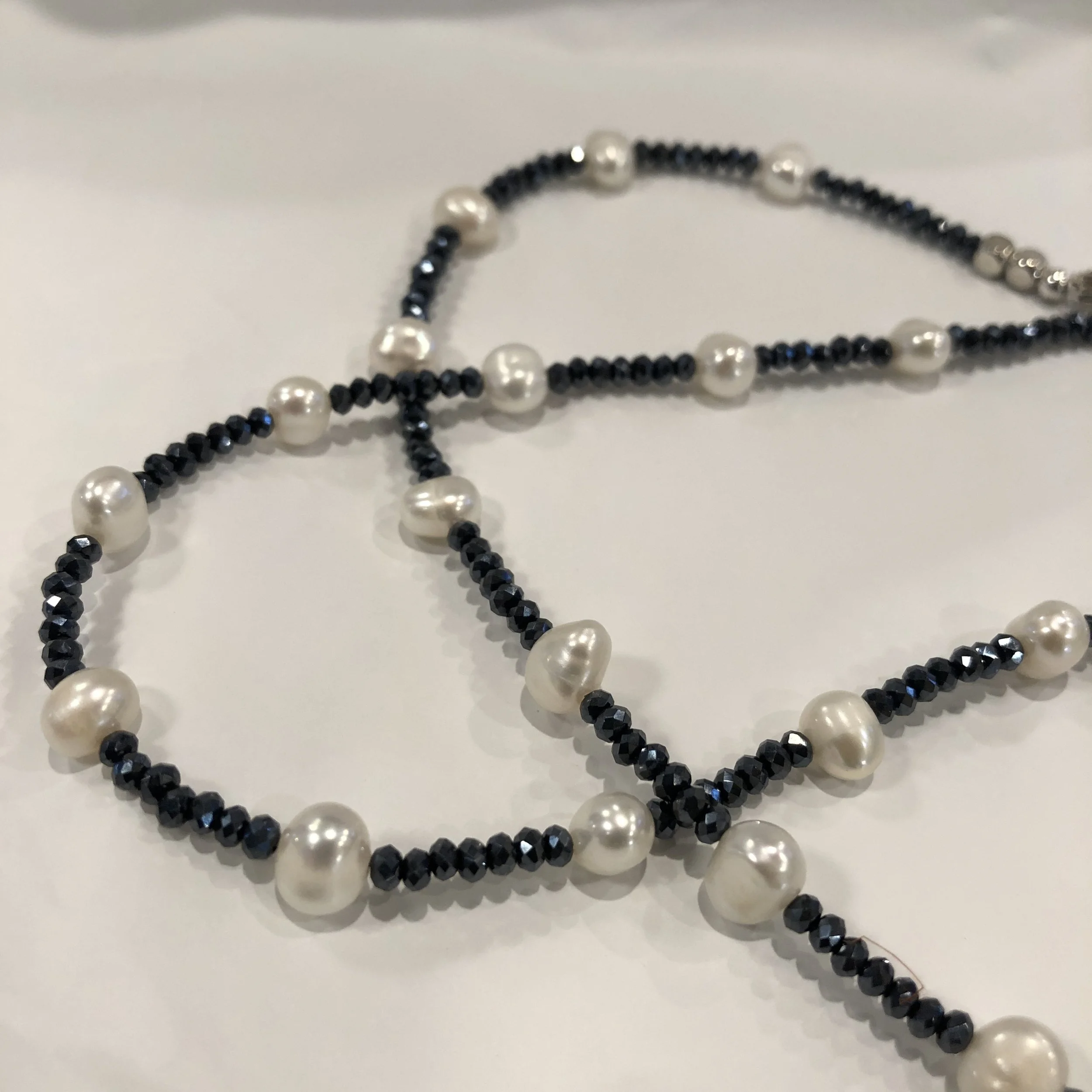 White pearls and raw sapphires