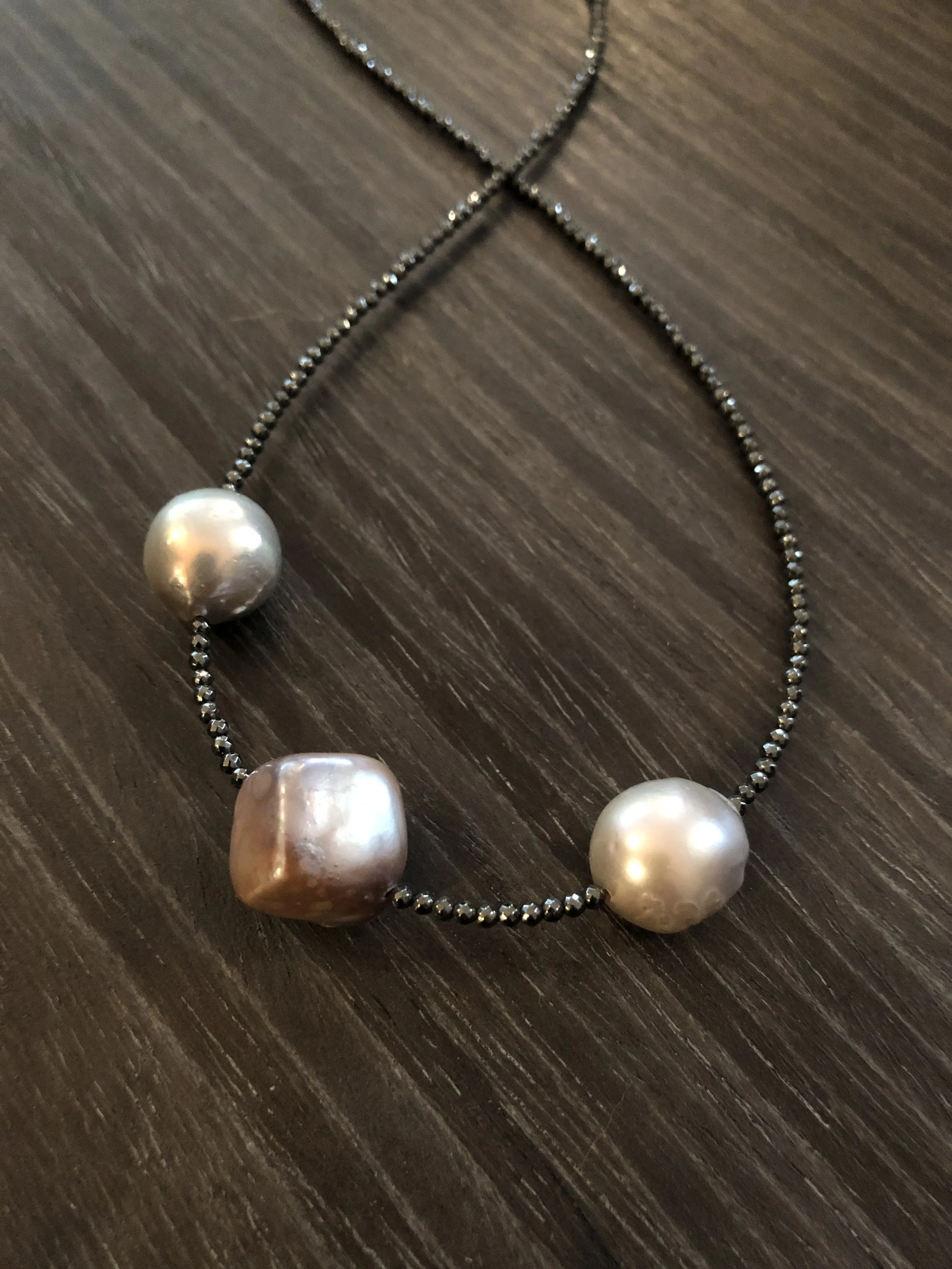 Large pearls, tiny spinel 