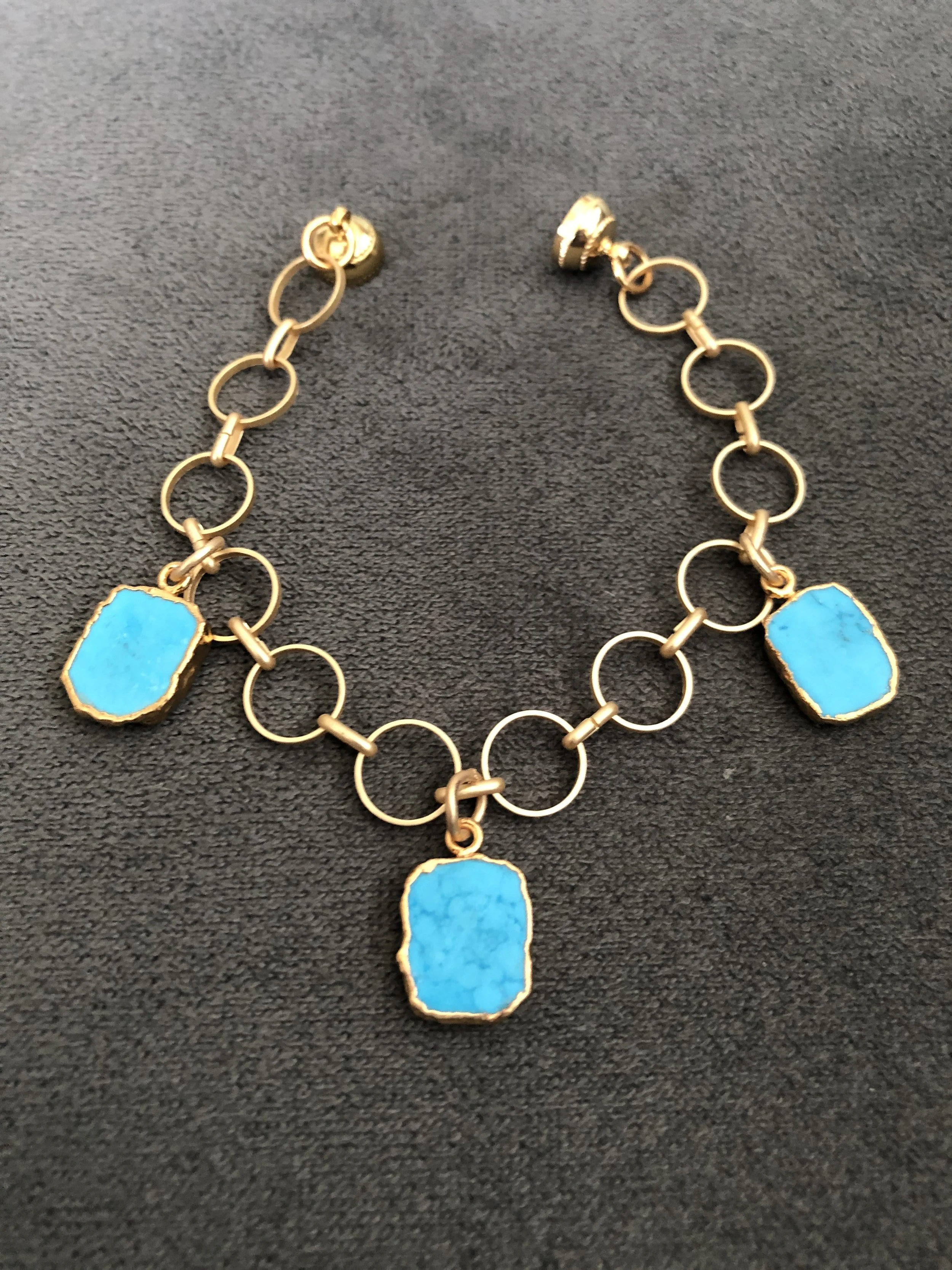 Turquoise chalcedony slices on gold circle bracelet