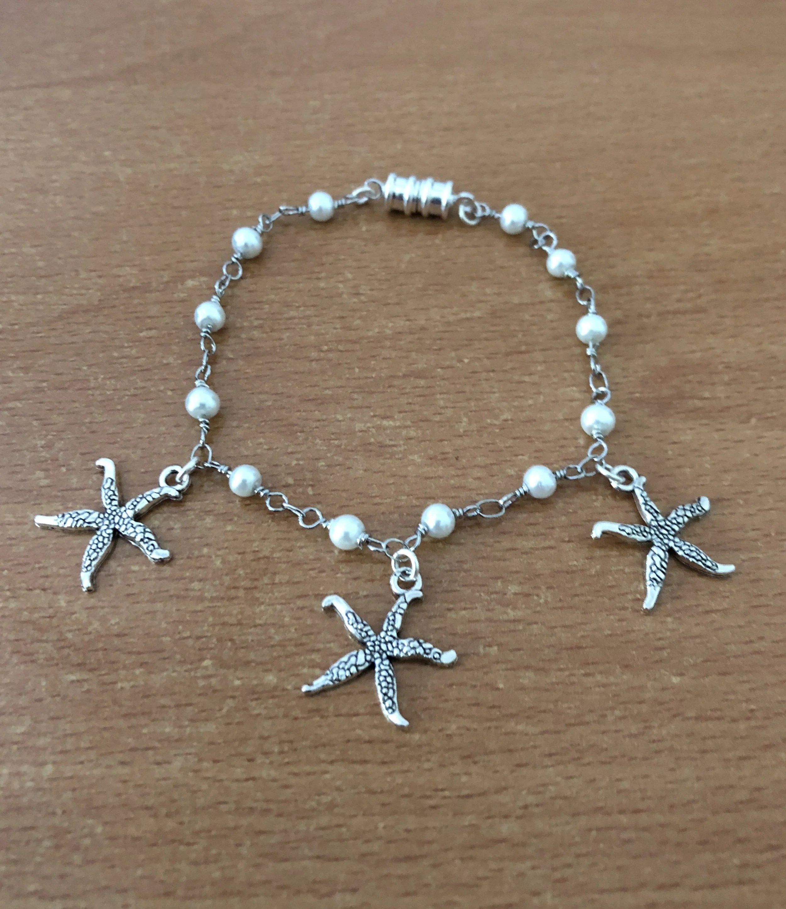 Silver starfish and pearl bracelet