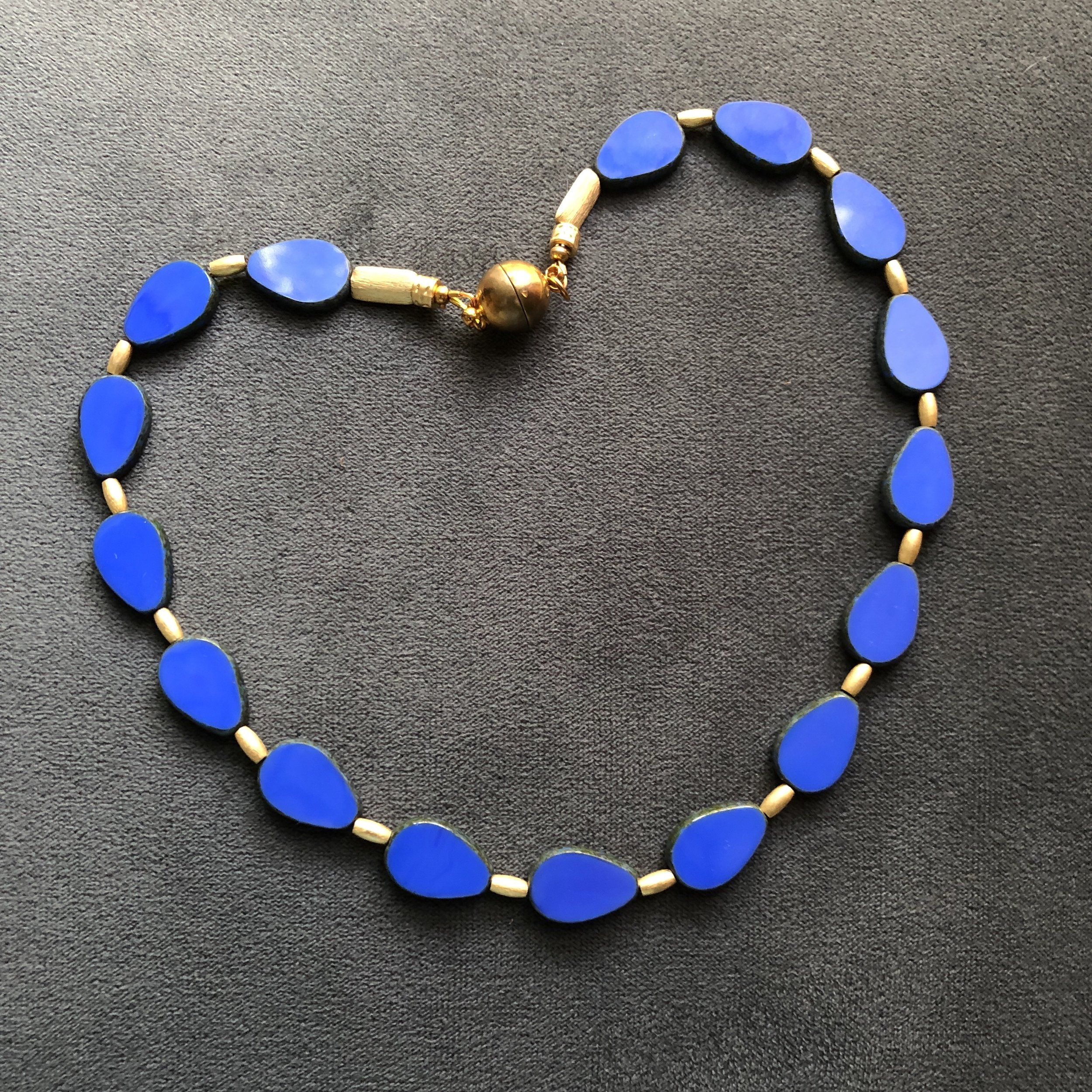 Bold blue teardrops with brushed matte gold 