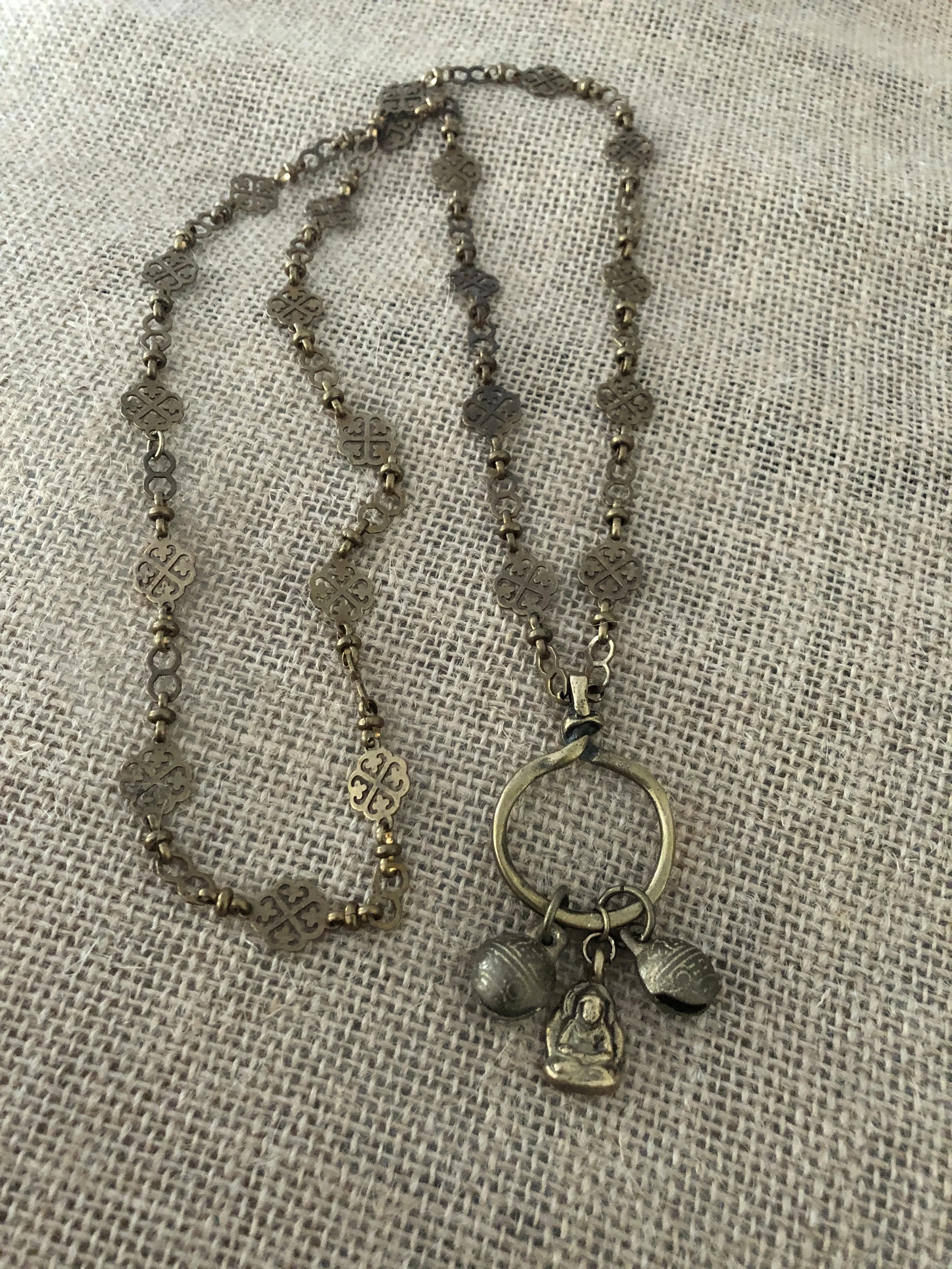 Brass amulets on vintage chain