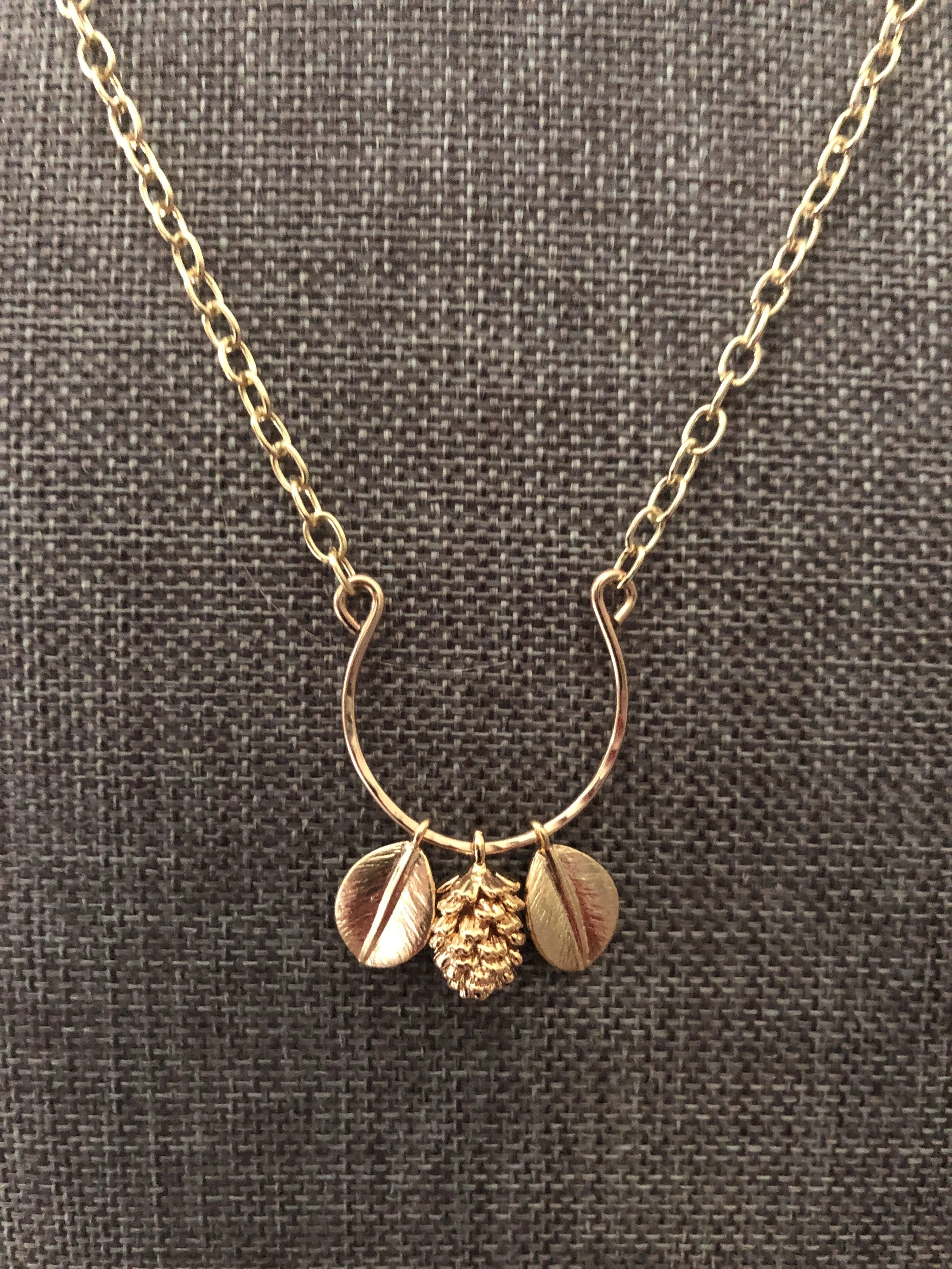 Gold pinecone and leaf charm necklace