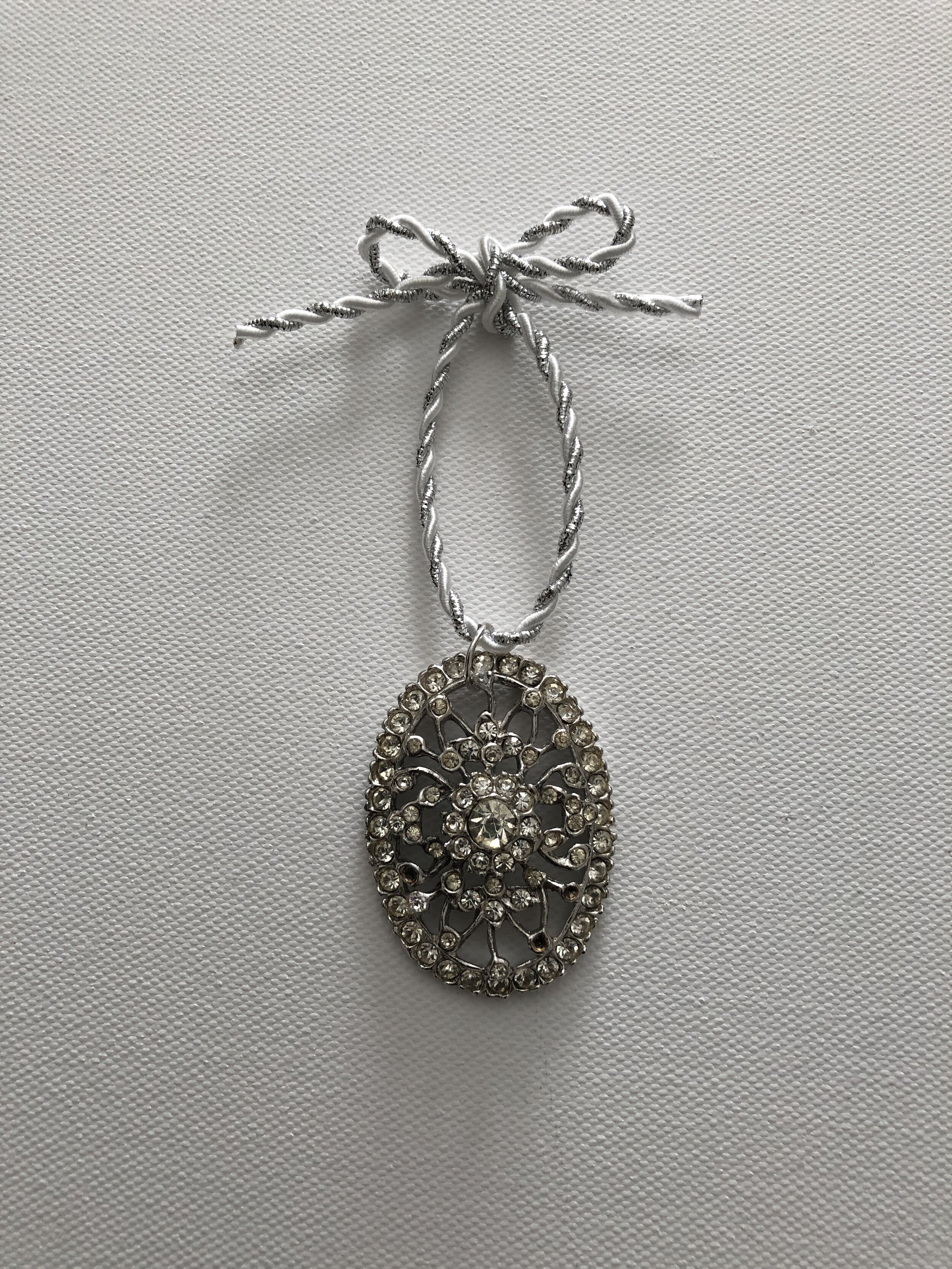 Sparkling silver medallion ornament 
