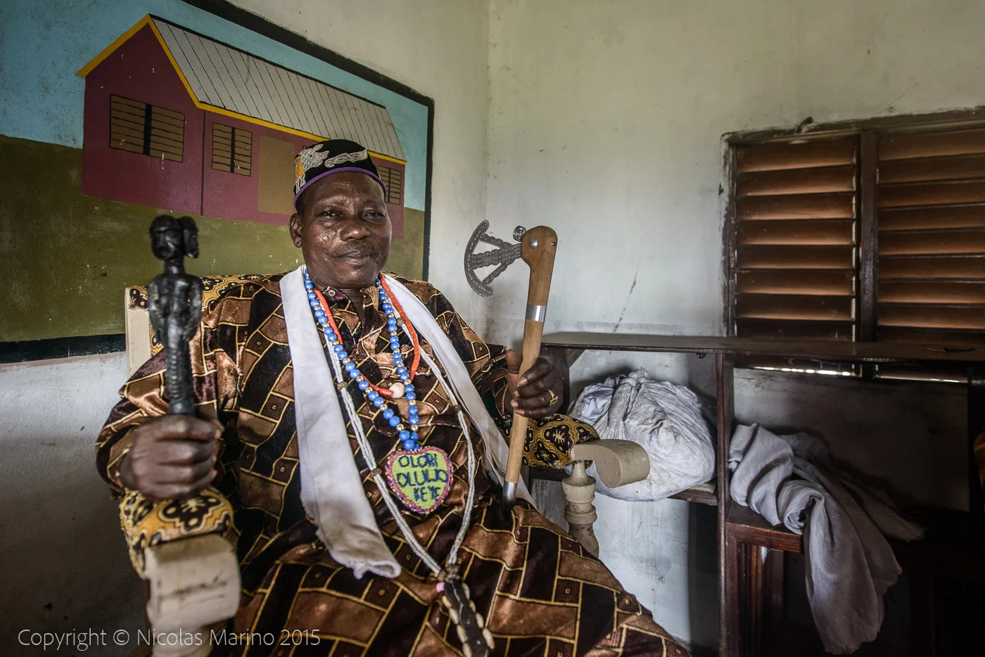 The king of Ganvié, a voodoo priest and his fetishes.