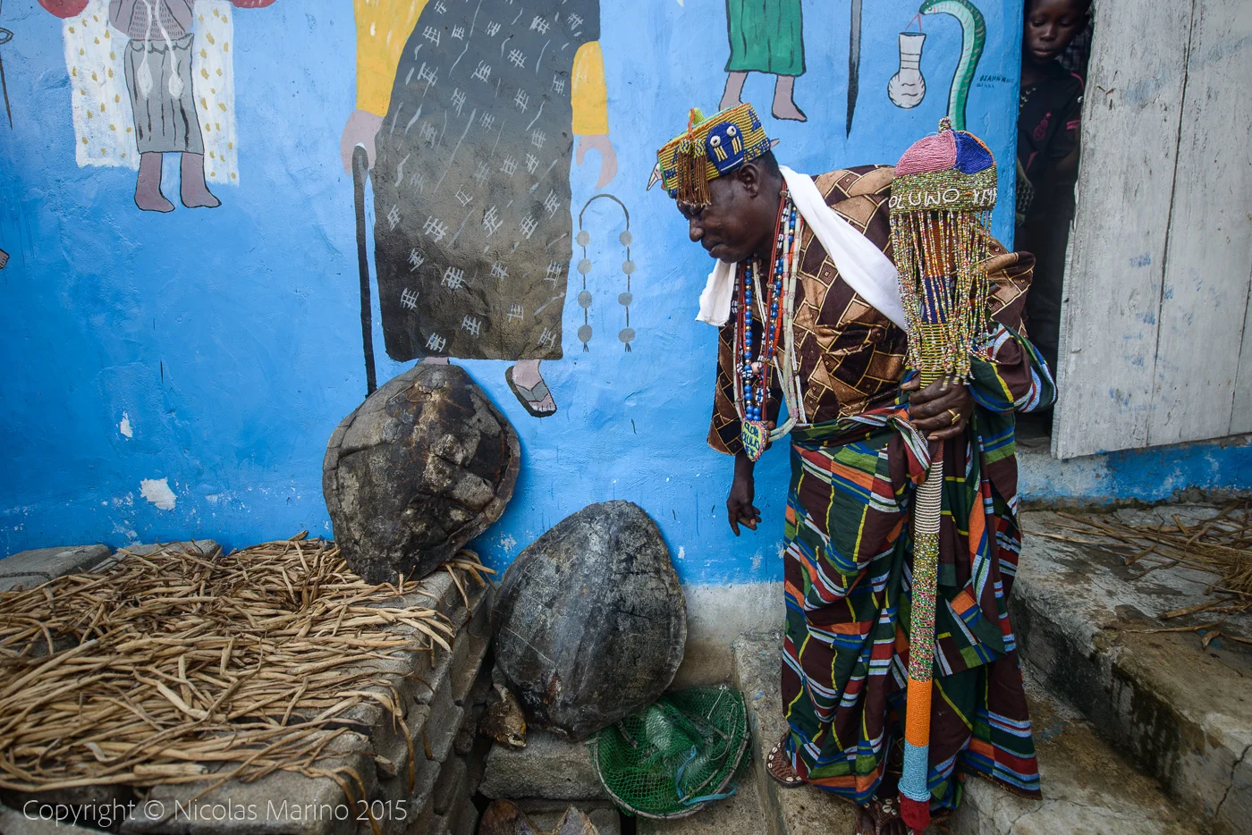The king of Ganvié, a voodoo priest and his fetishes.