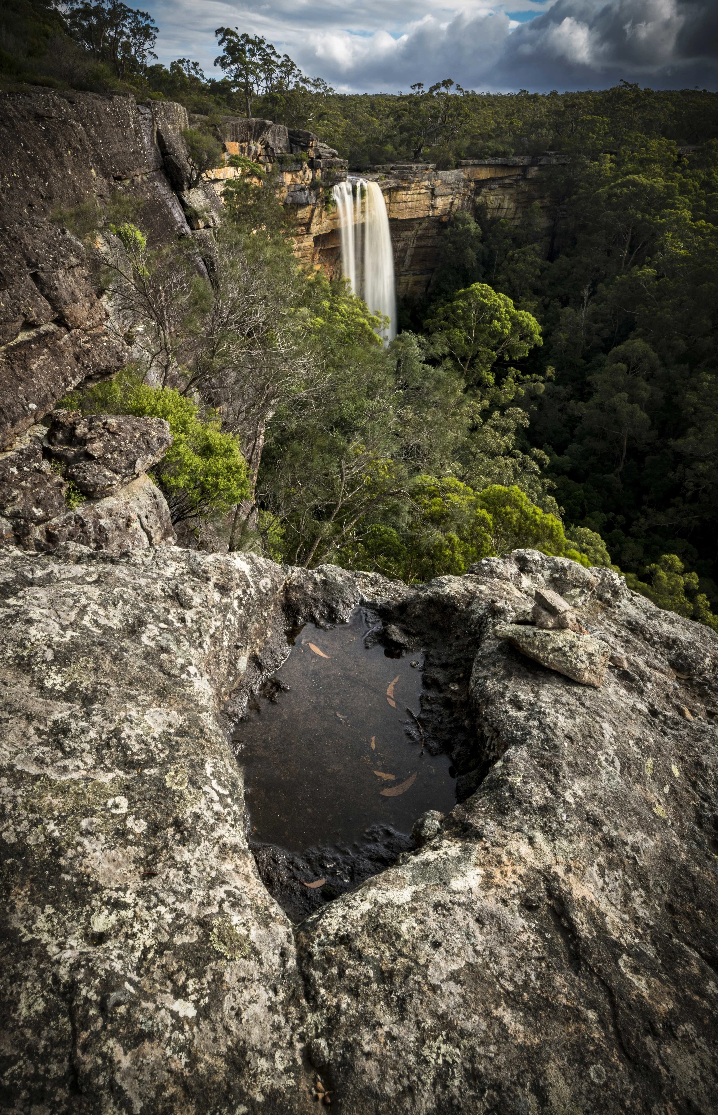 Powerful waterfall of Tianjara Falls surrounded by lush greenery