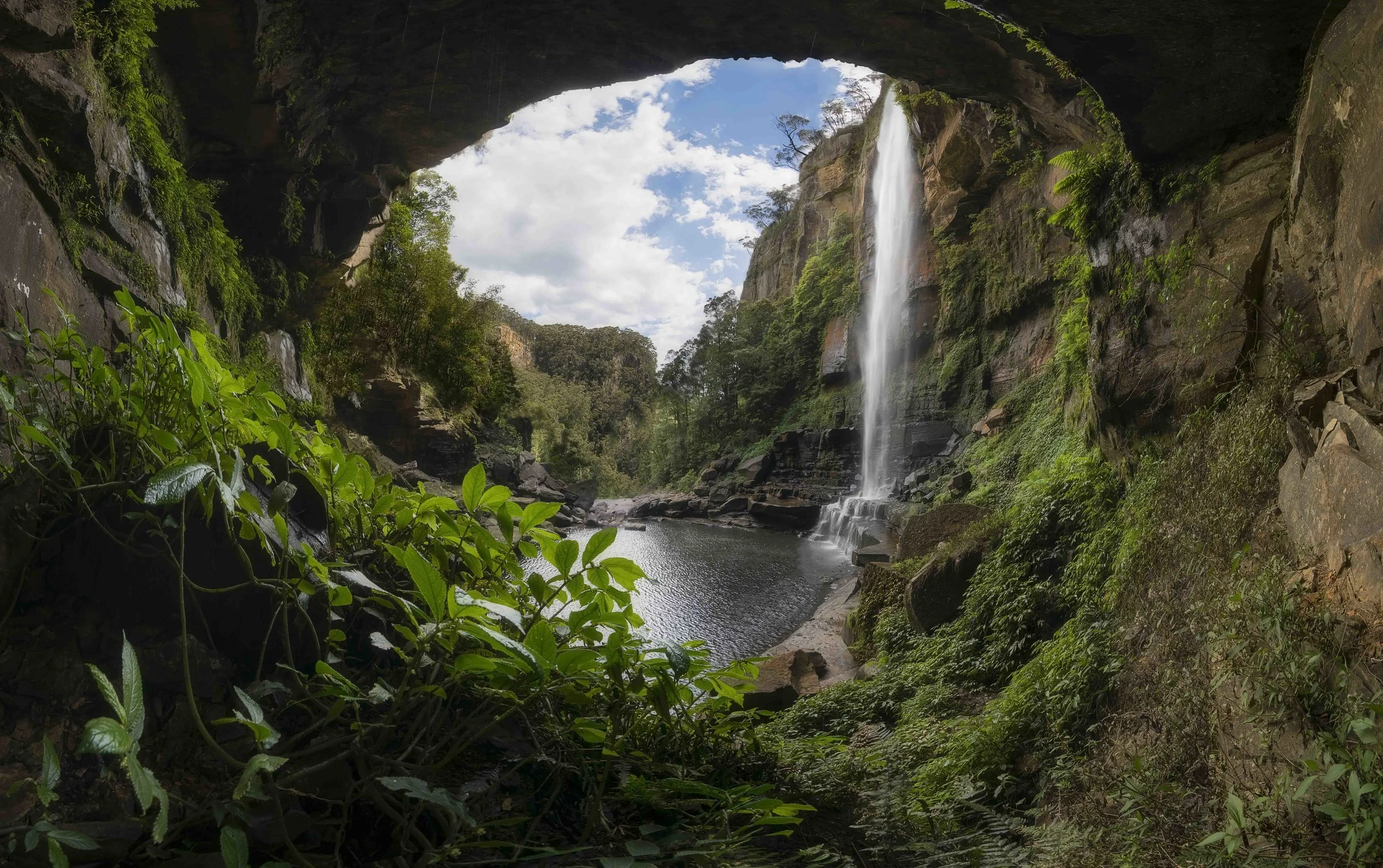 Cascading Belmore Falls surrounded by lush greenery