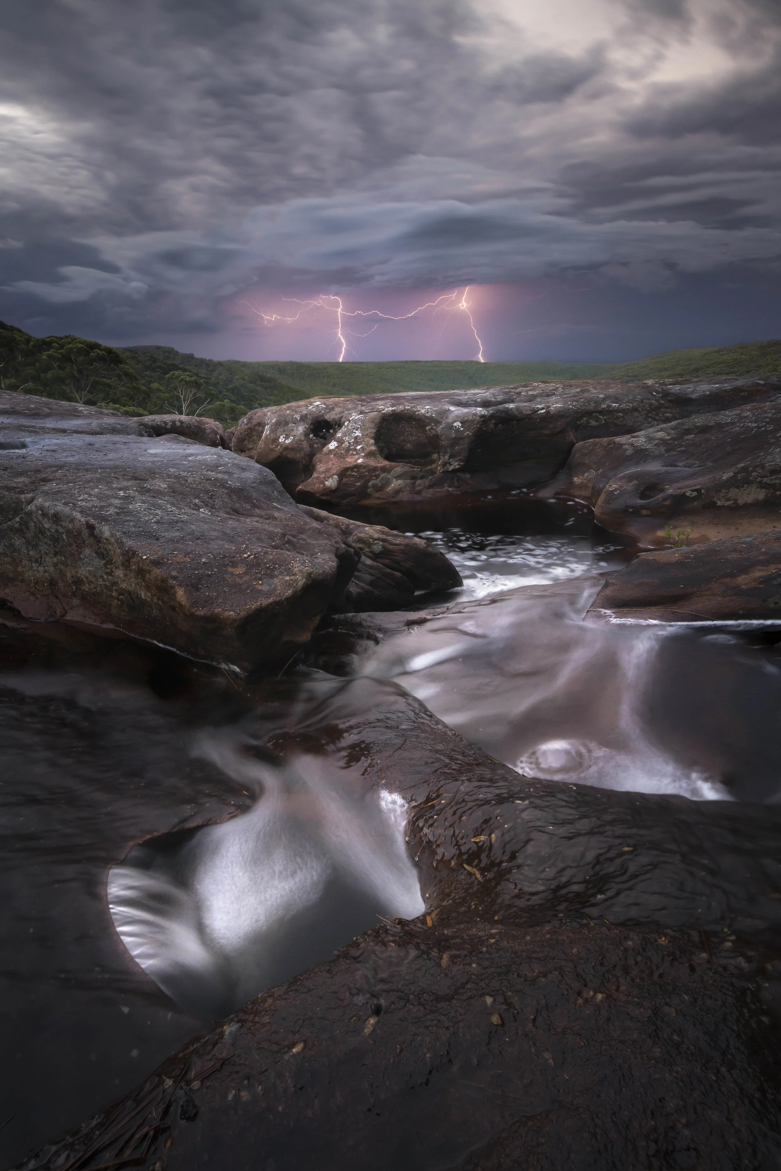 Tianjara Falls with lightning in the background
