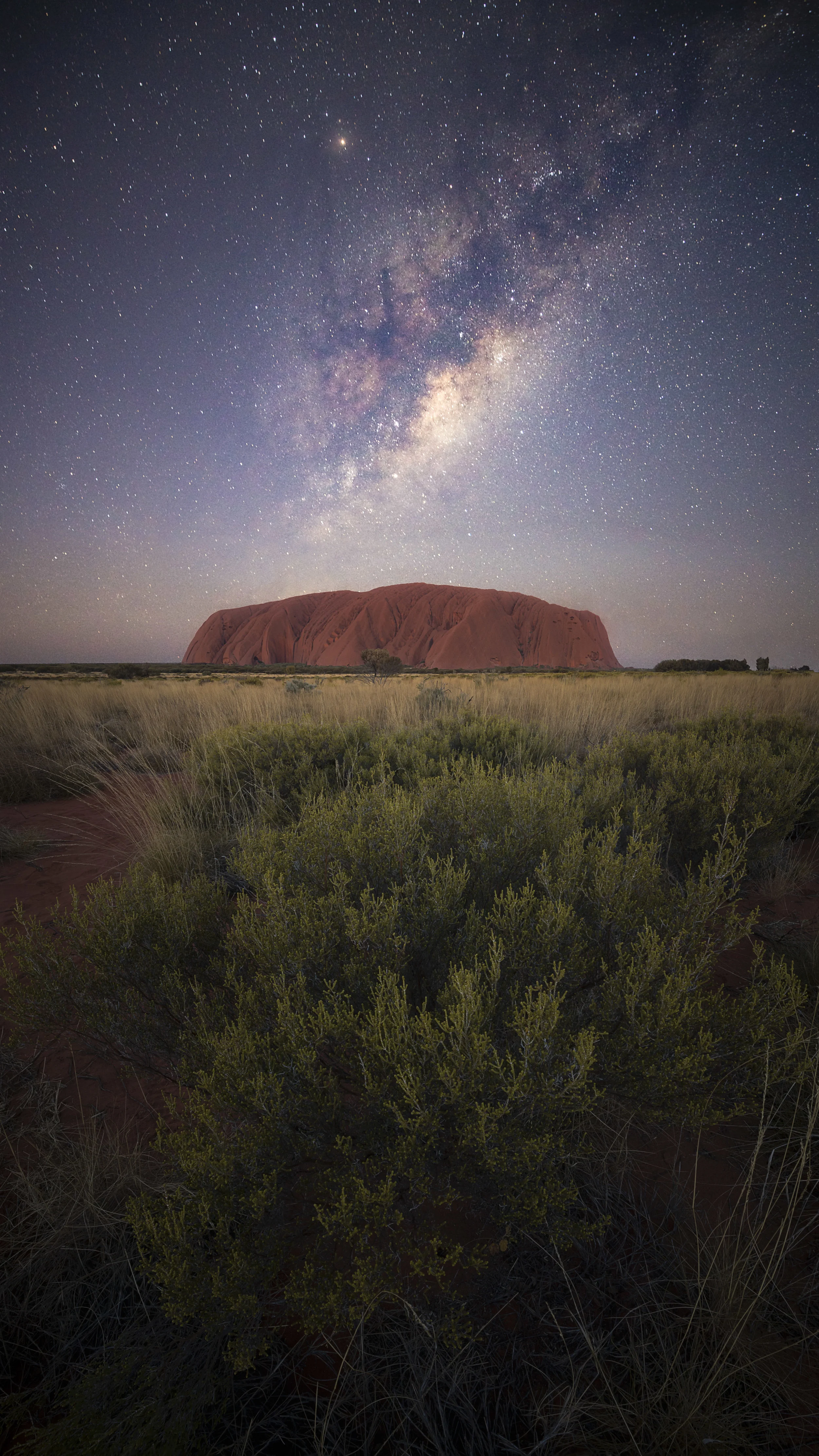 Night sky filled with stars above Uluru, captured by Samuel Markham