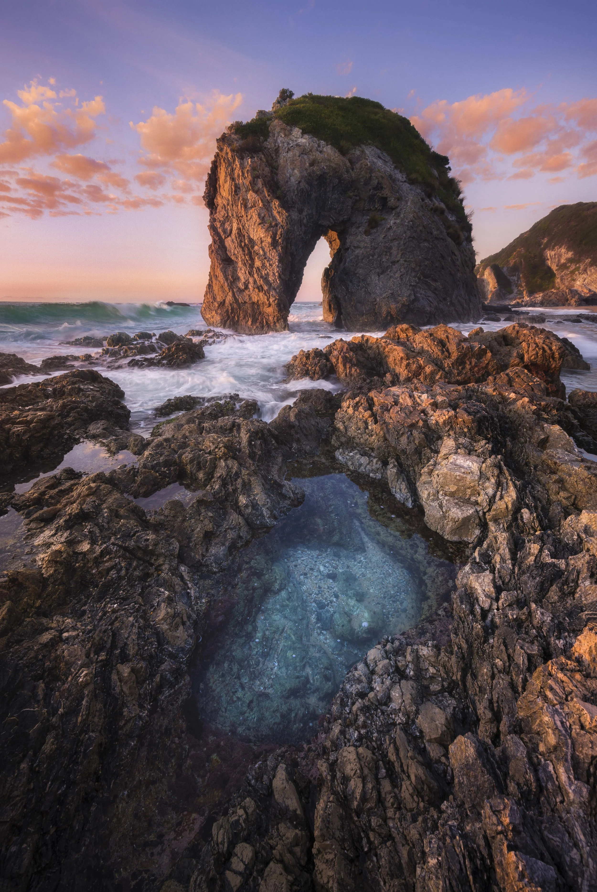 Sunrise at Horse Head Rock with a rock pool in the foreground