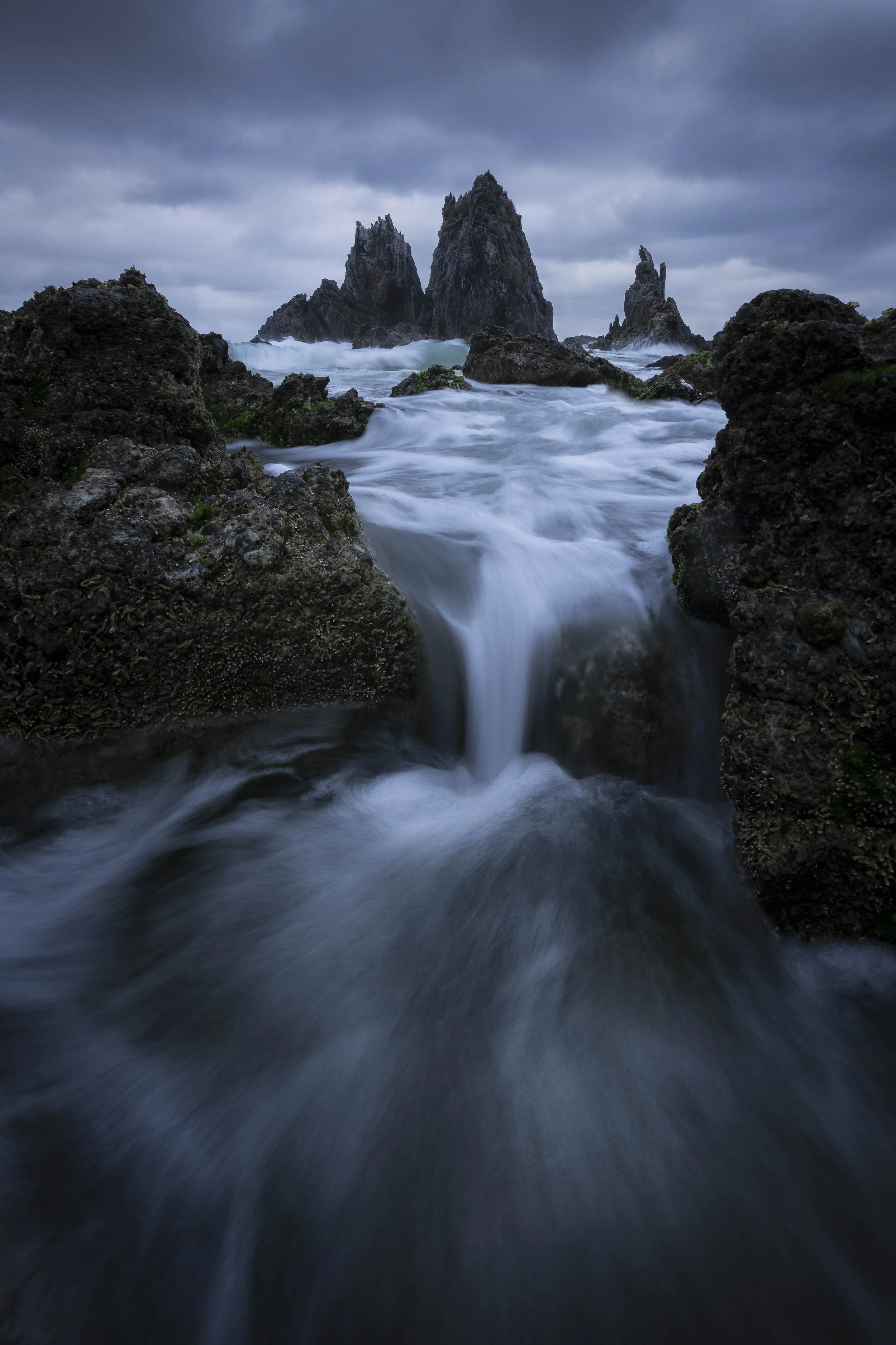 Moody seas surrounding Camel Rock, New South Wales